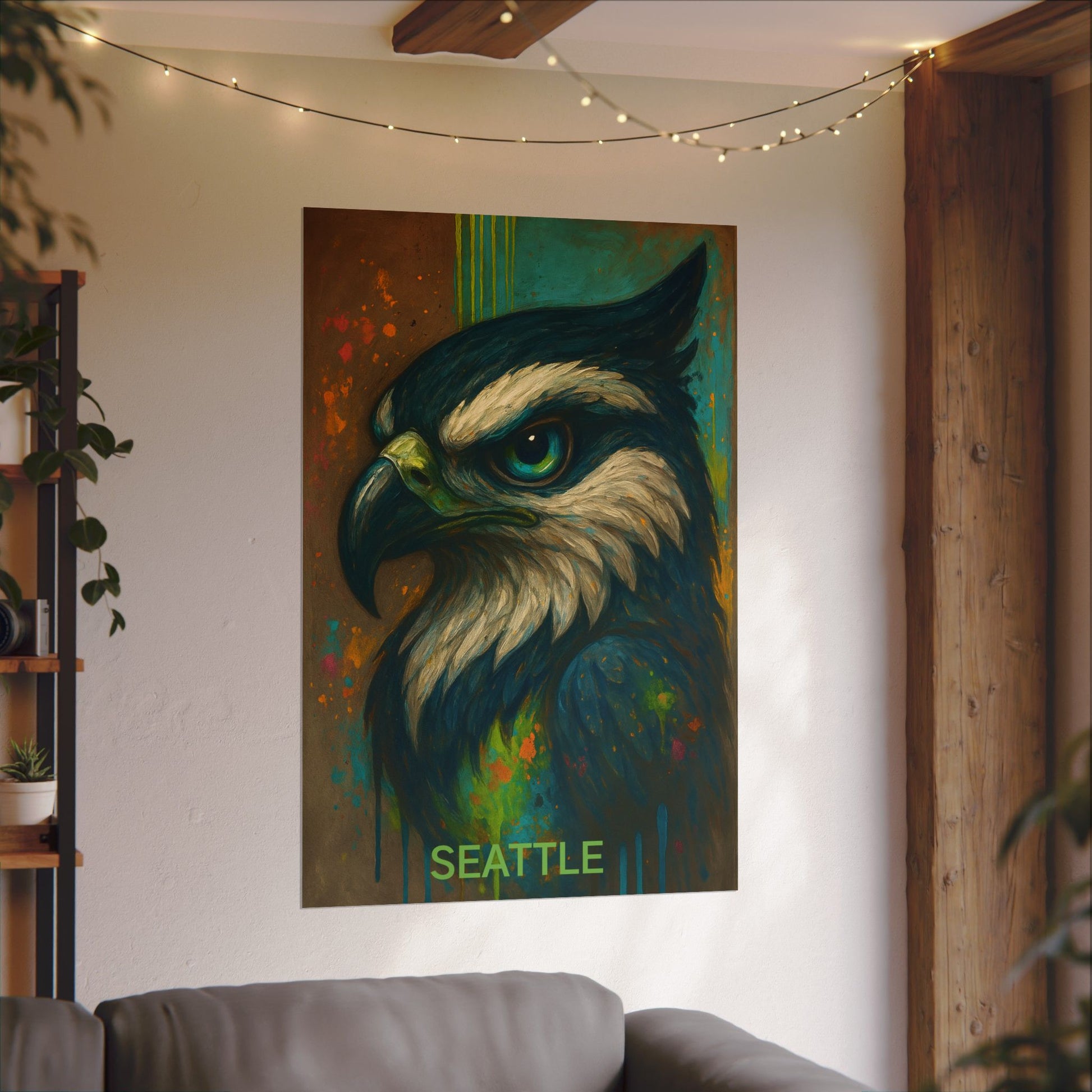 Colorful painting of an eagle head on a wall above a sofa with 'Seattle' text