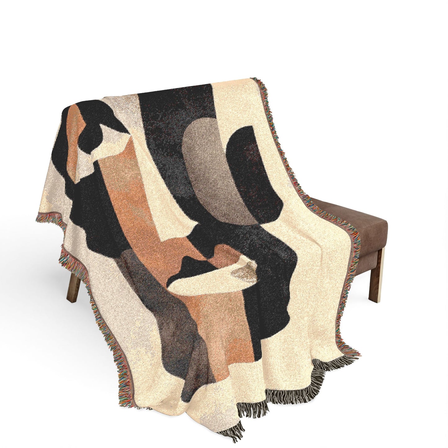 Abstract patterned throw blanket draped over a chair on a white background