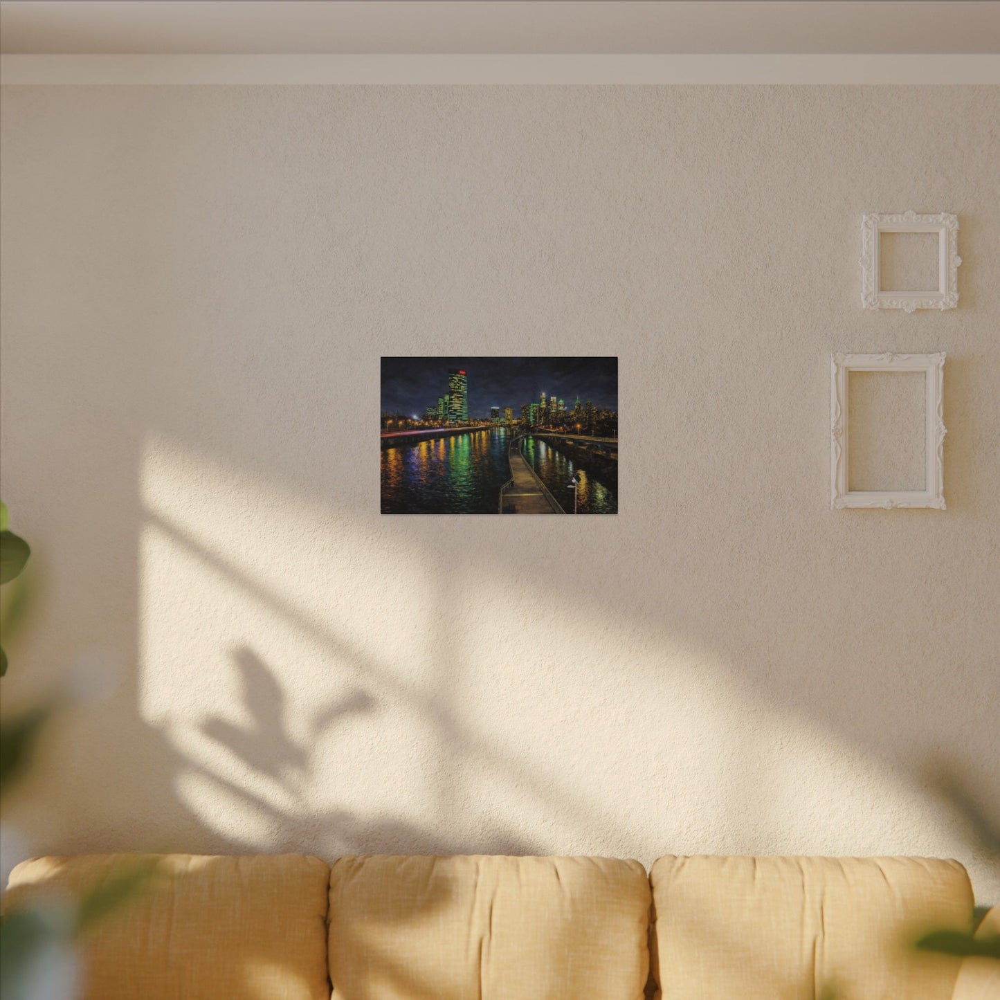 Dark green rectangular sign with 'LEN BUFFS' on a beige wall above a yellow sofa.
