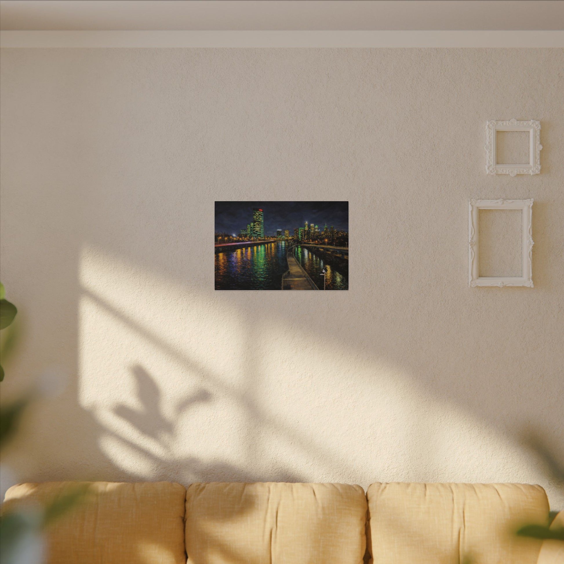 Dark green rectangular sign with 'LEN BUFFS' on a beige wall above a yellow sofa.