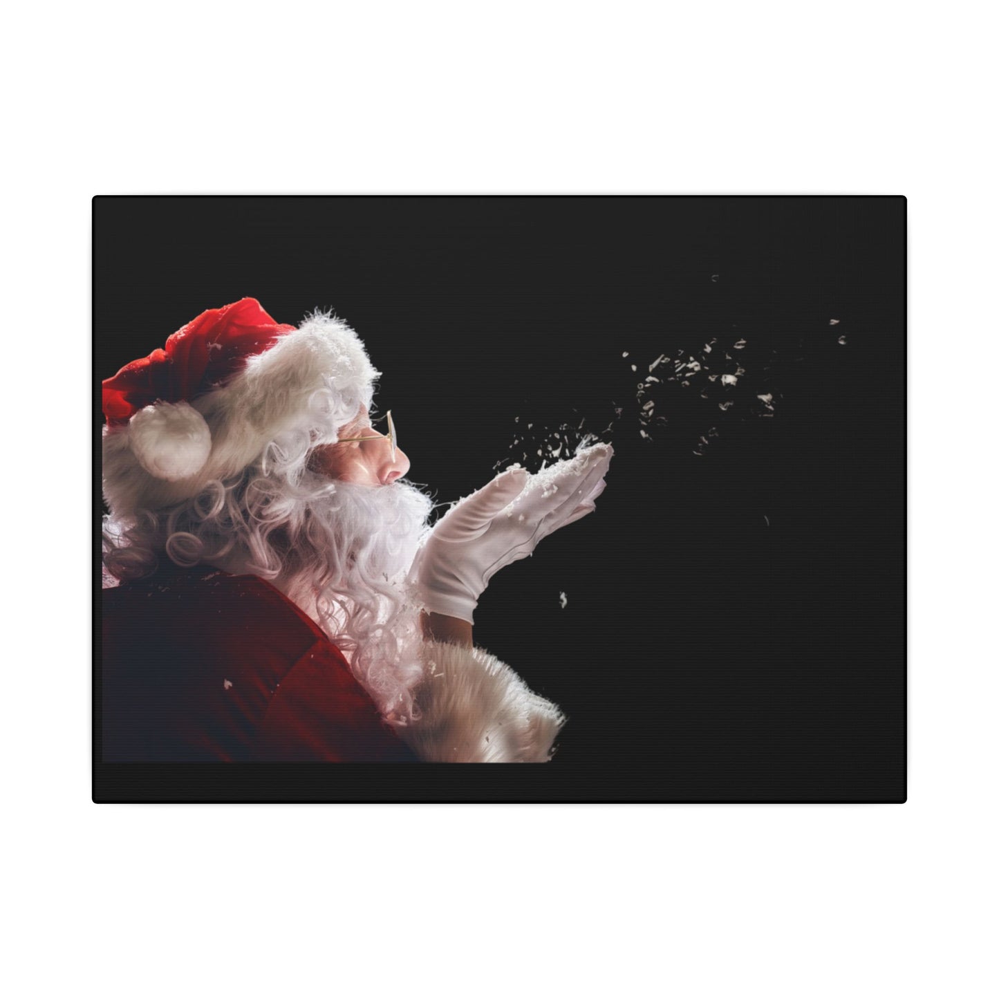 Santa Claus blowing snowflakes against a black background