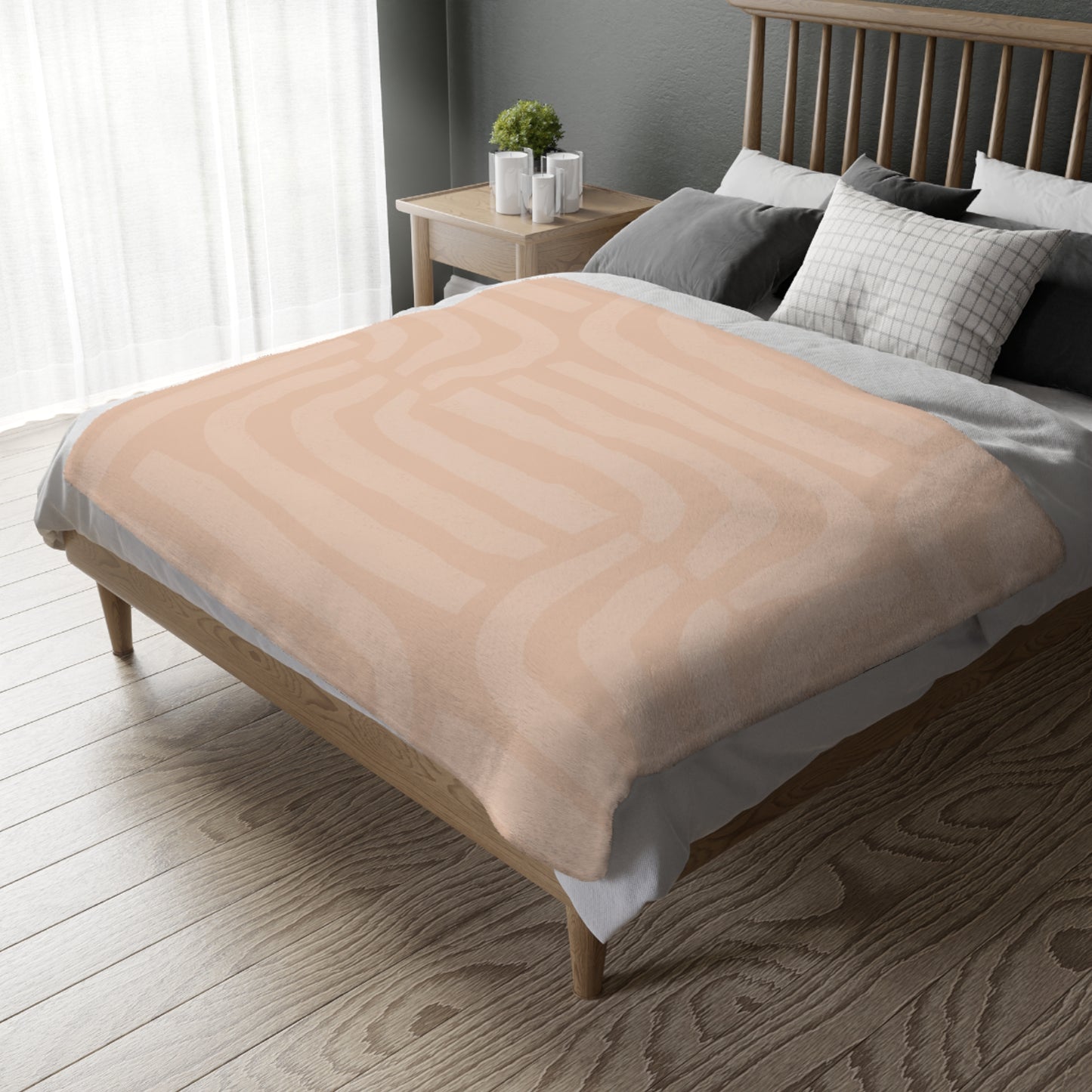Beige blanket on a bed in a bedroom setting with a wooden headboard and nightstand.