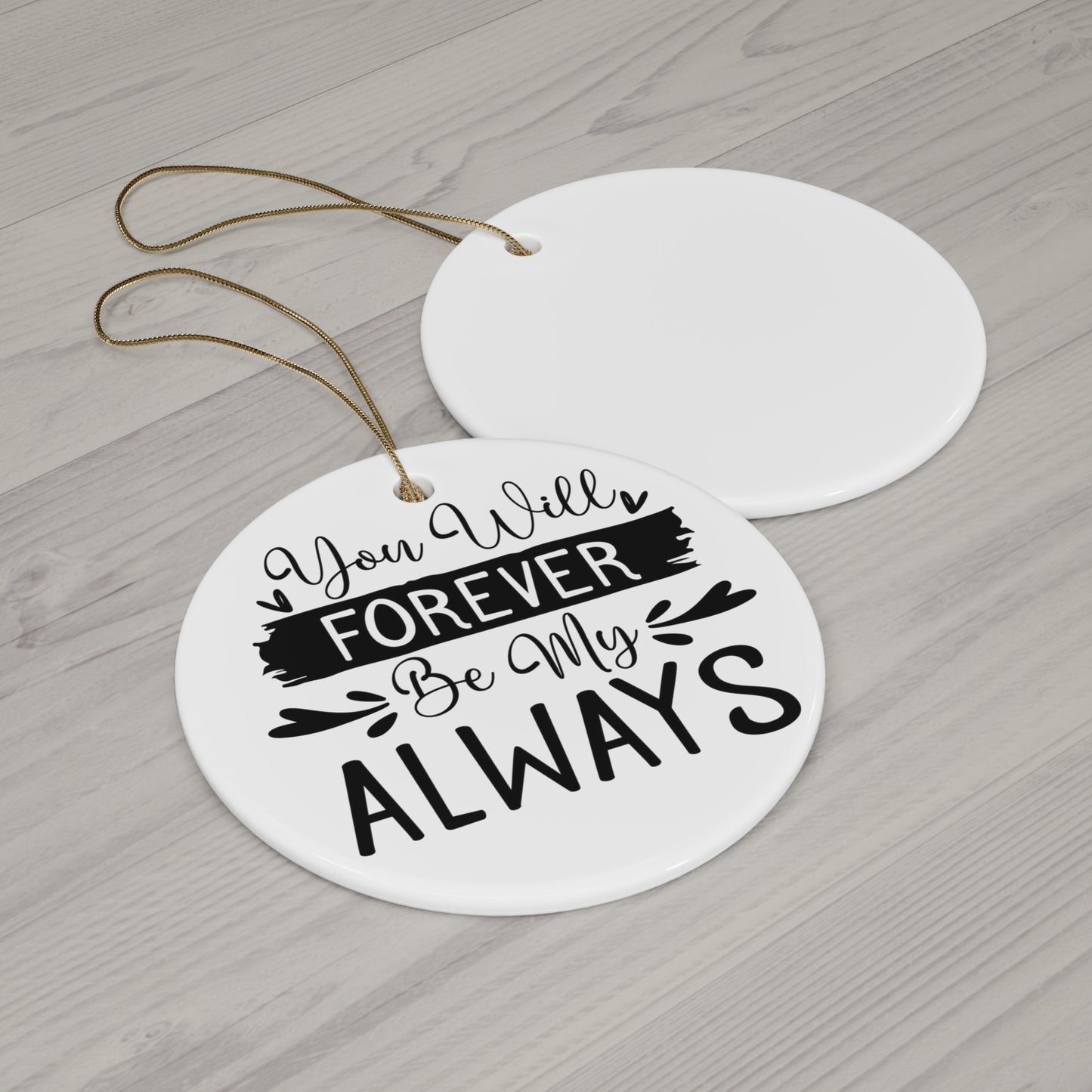 Round ceramic ornament with 'You Will Forever Be My Always' text on a wooden surface