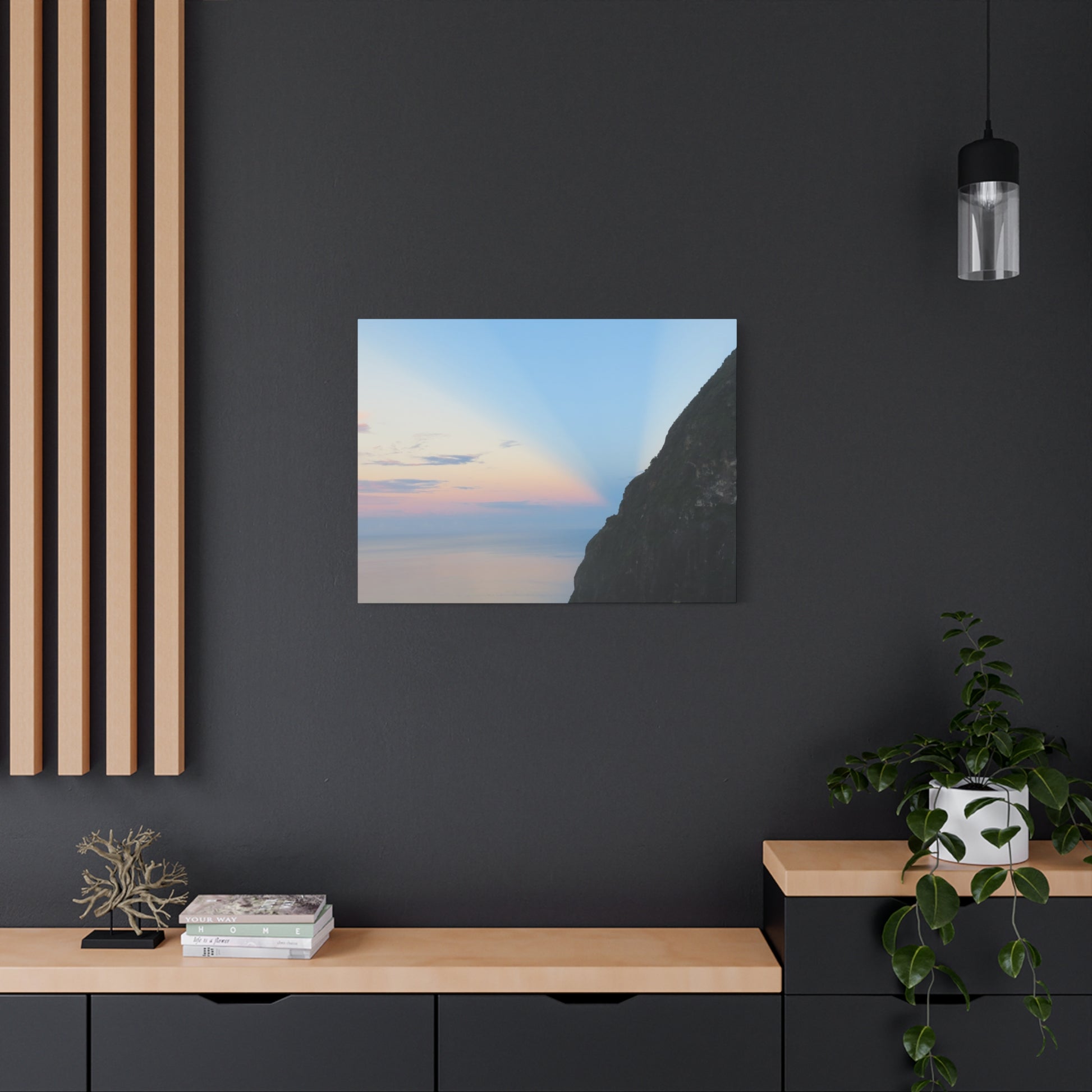 Modern interior with a painting of a mountain landscape on a dark wall.