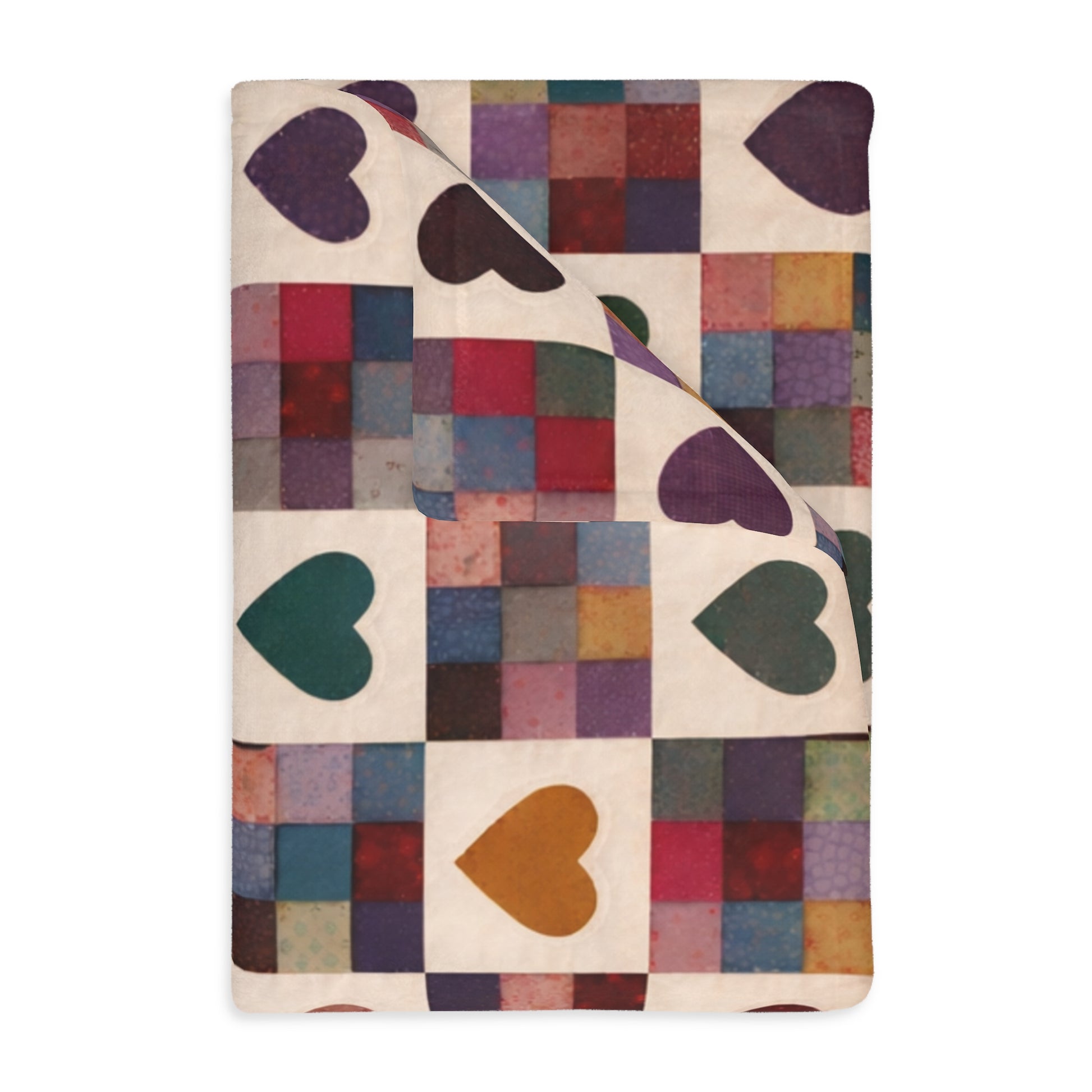 Colorful quilt with heart patterns on a white background