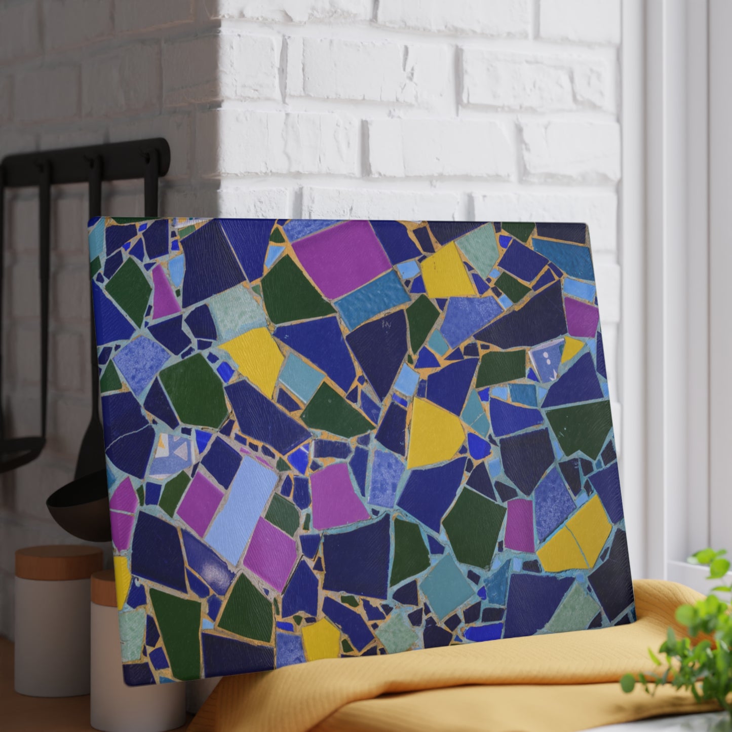 Colorful mosaic art piece on a white brick wall