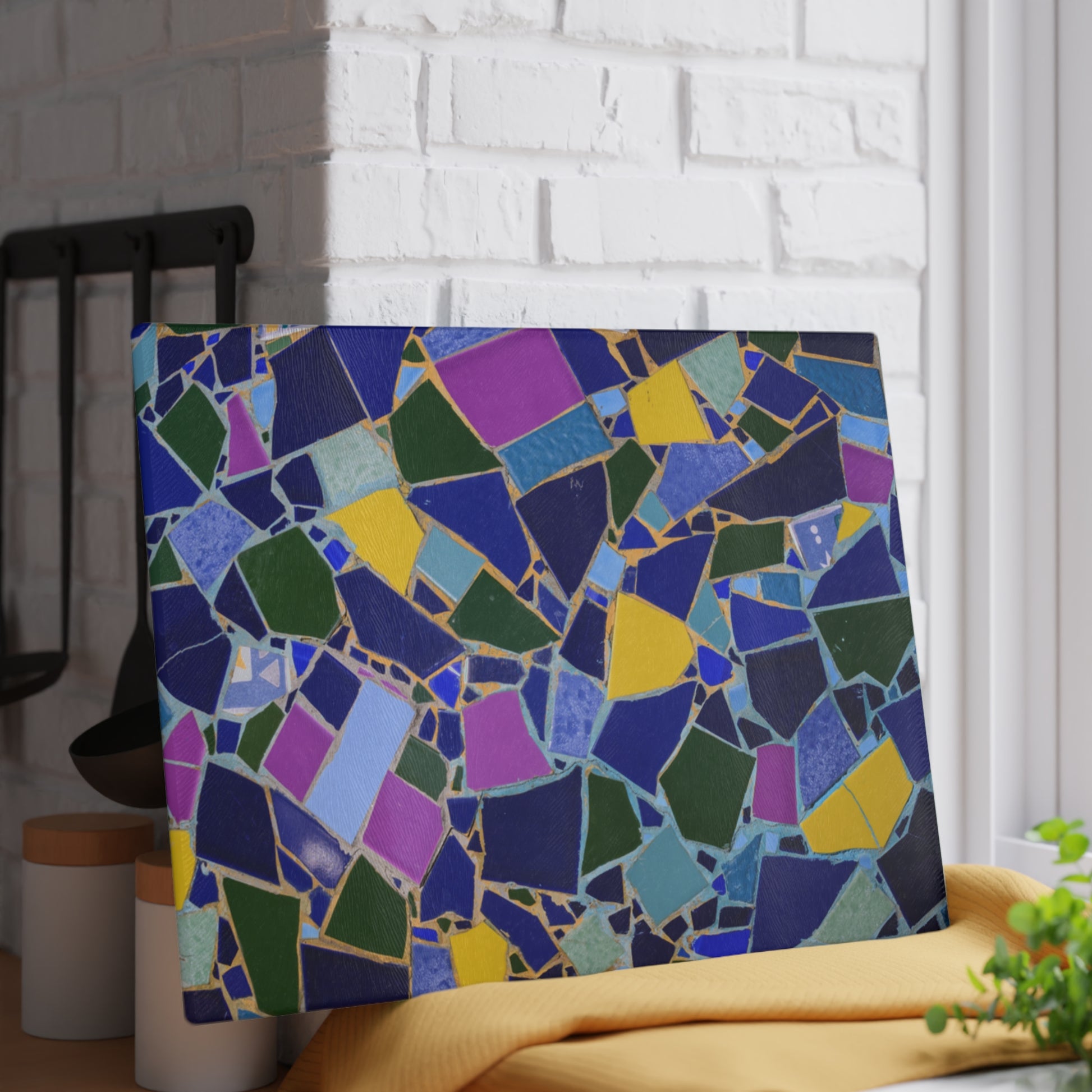 Colorful mosaic art piece on a white brick wall