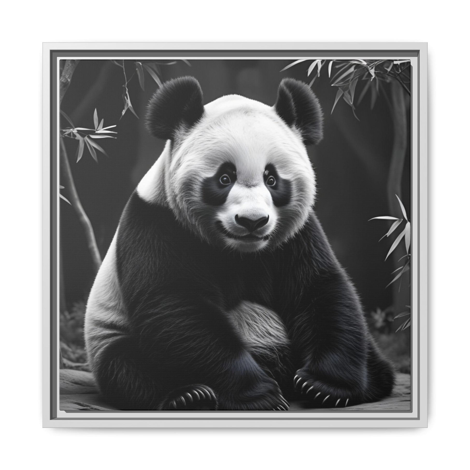 Framed artwork of a panda bear sitting on a branch with bamboo leaves in the background.