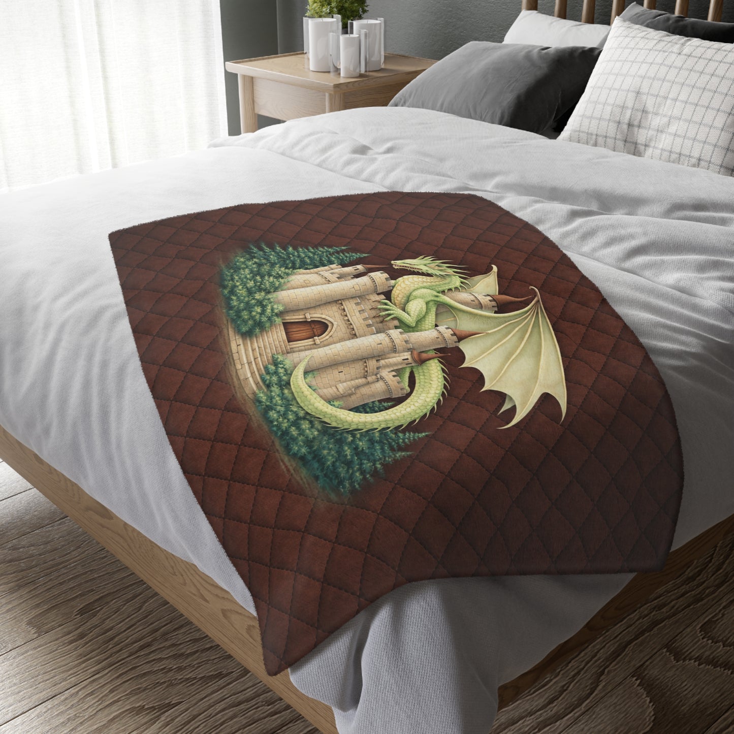 Decorative blanket with dragon design on a bed in a bedroom setting