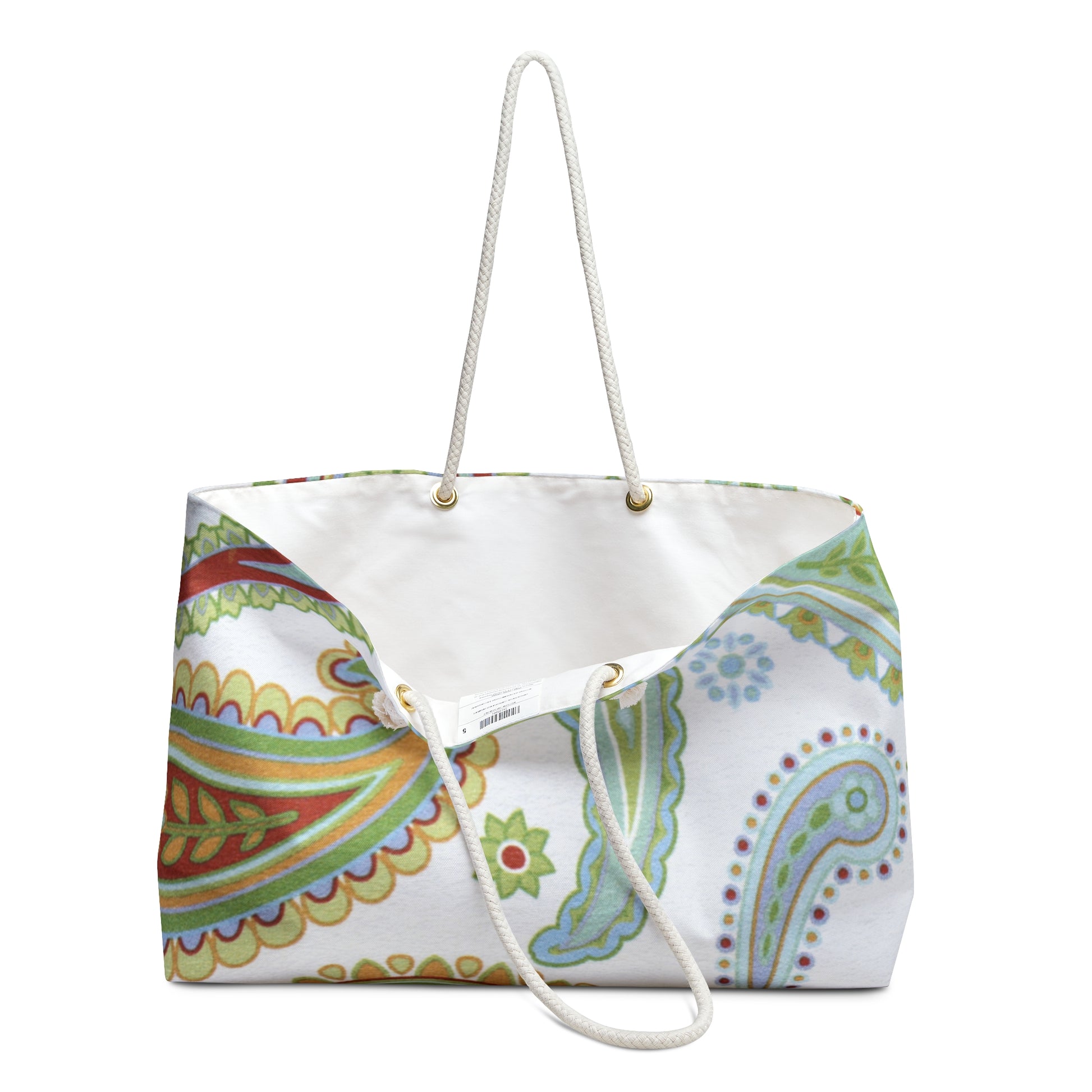 Colorful patterned tote bag with a white handle on a white background