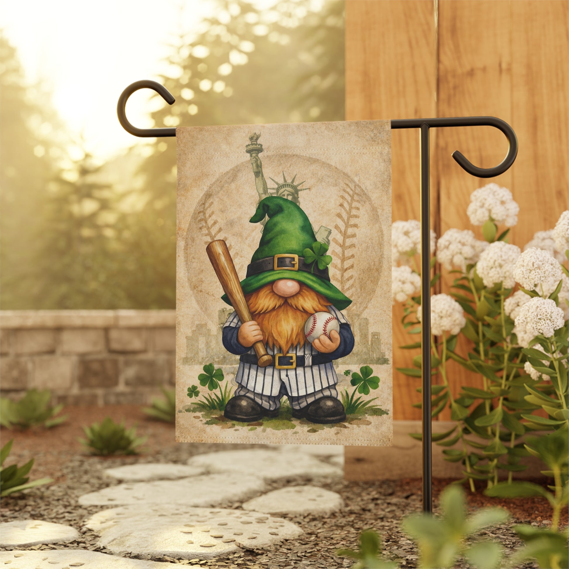 Gnome holding a baseball bat and ball on a decorative flag with a garden setting.