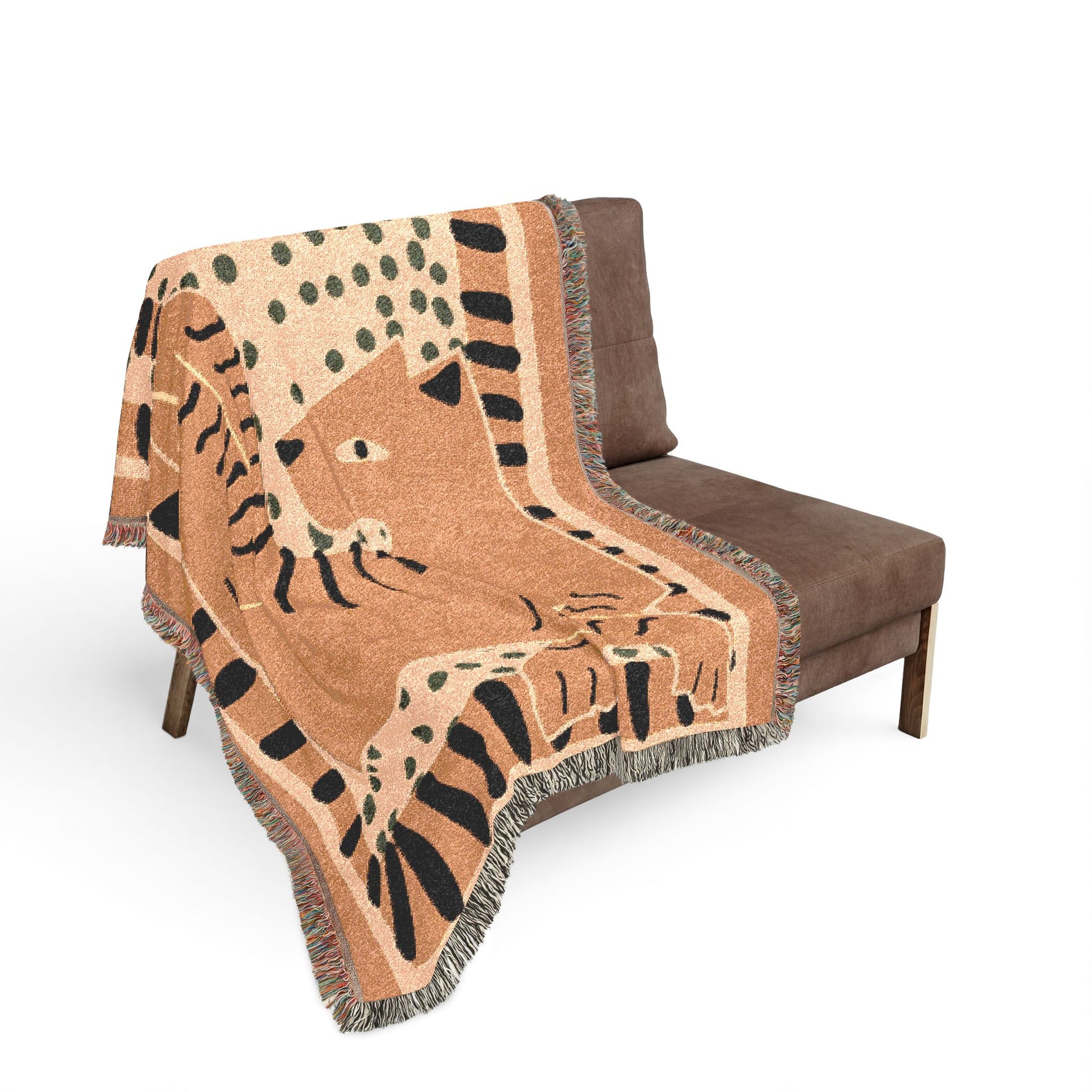 Decorative blanket with animal pattern draped over a brown chair on a white background