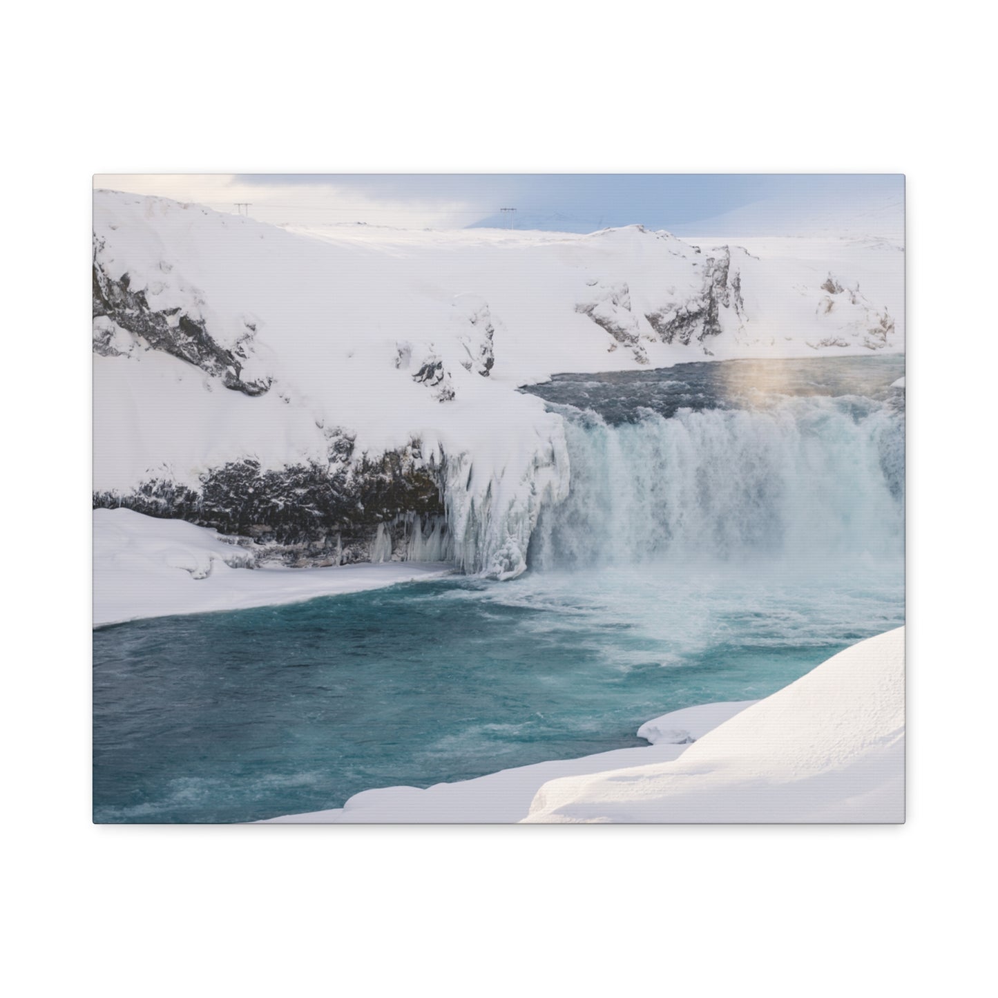 Frozen waterfall in a snowy landscape