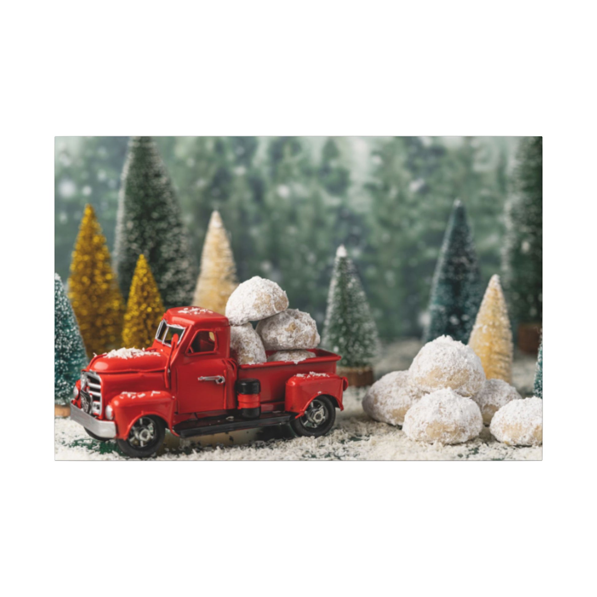 Red toy truck with snowballs in a Christmas-themed setting with trees and snow.