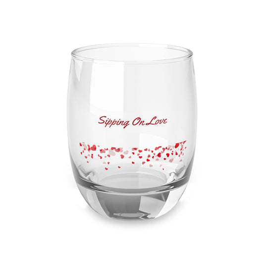 Clear glass with red text 'Sipping On Love' and heart shapes on a white background