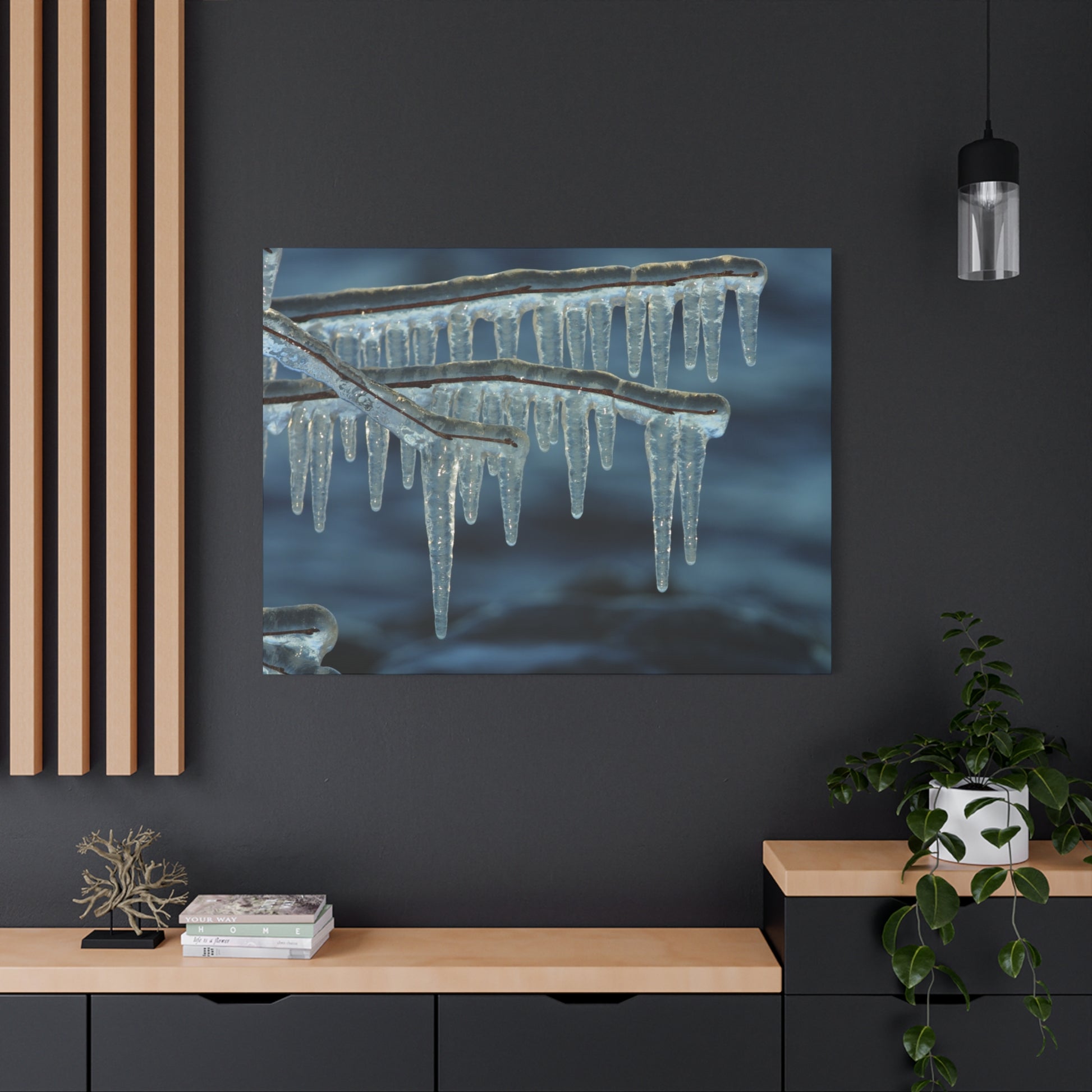 Framed artwork of icicles on a dark wall with wooden shelves and decor.