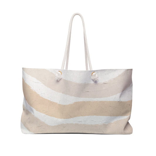 Beige and white striped tote bag on a white background