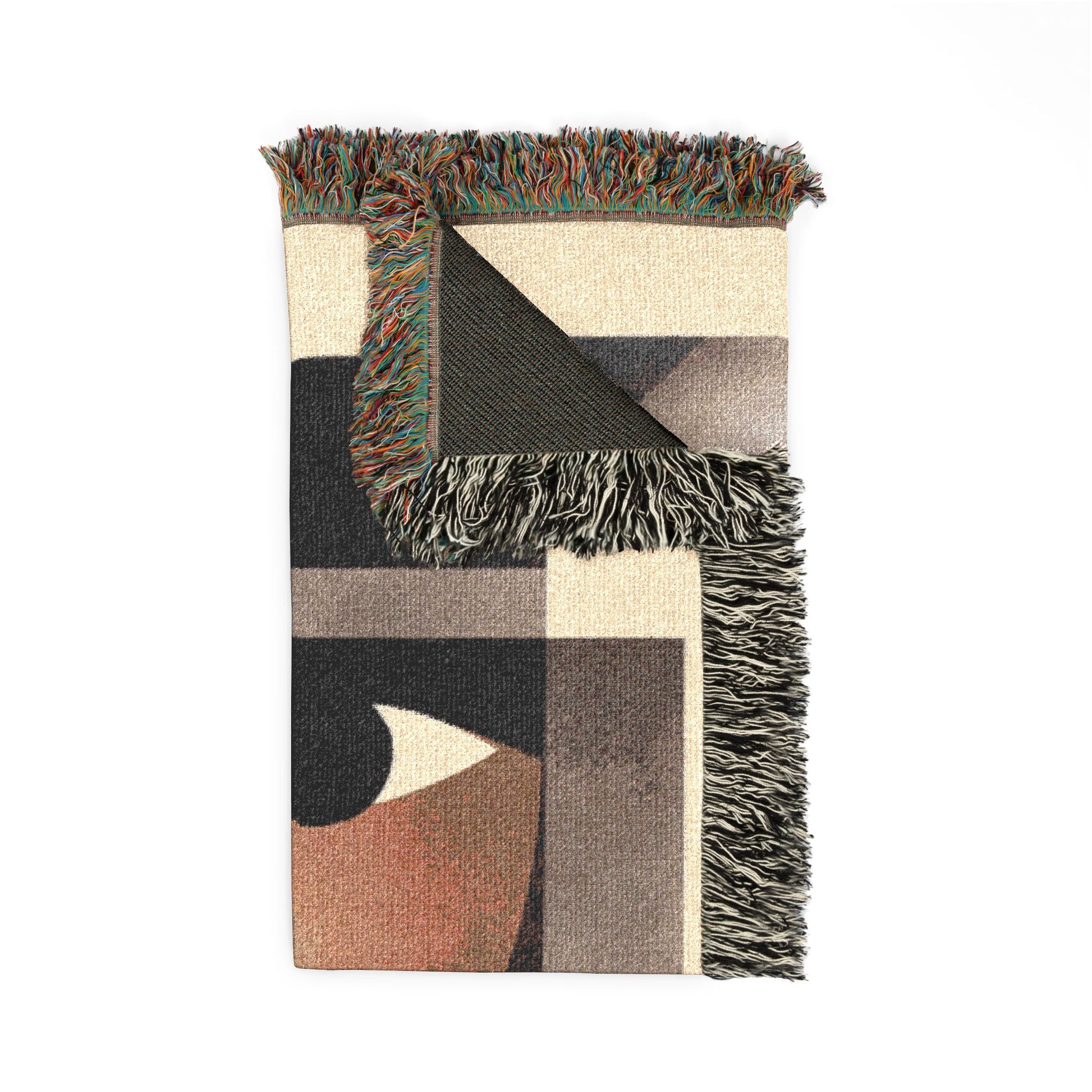 Woven blanket with geometric pattern and fringed edges on a white background