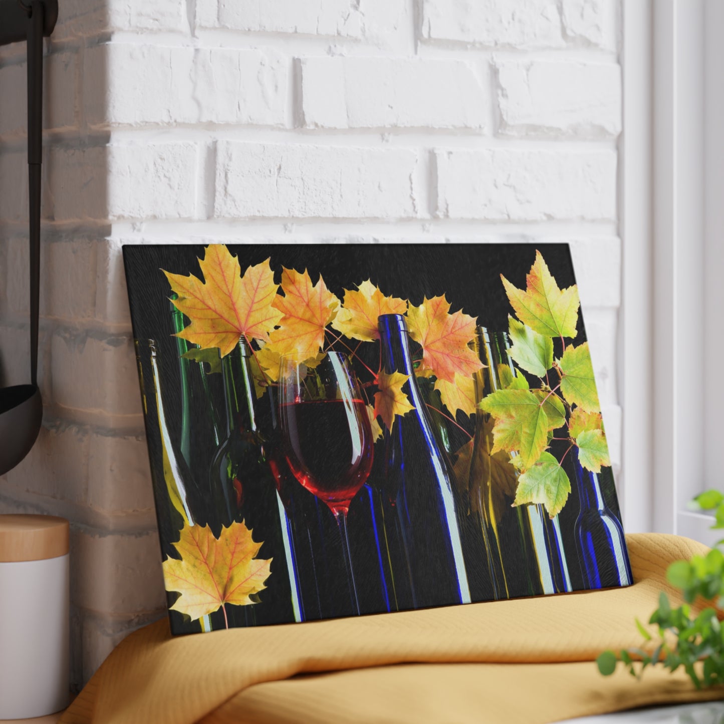 Canvas print with autumn leaves and wine bottles on a white brick wall background