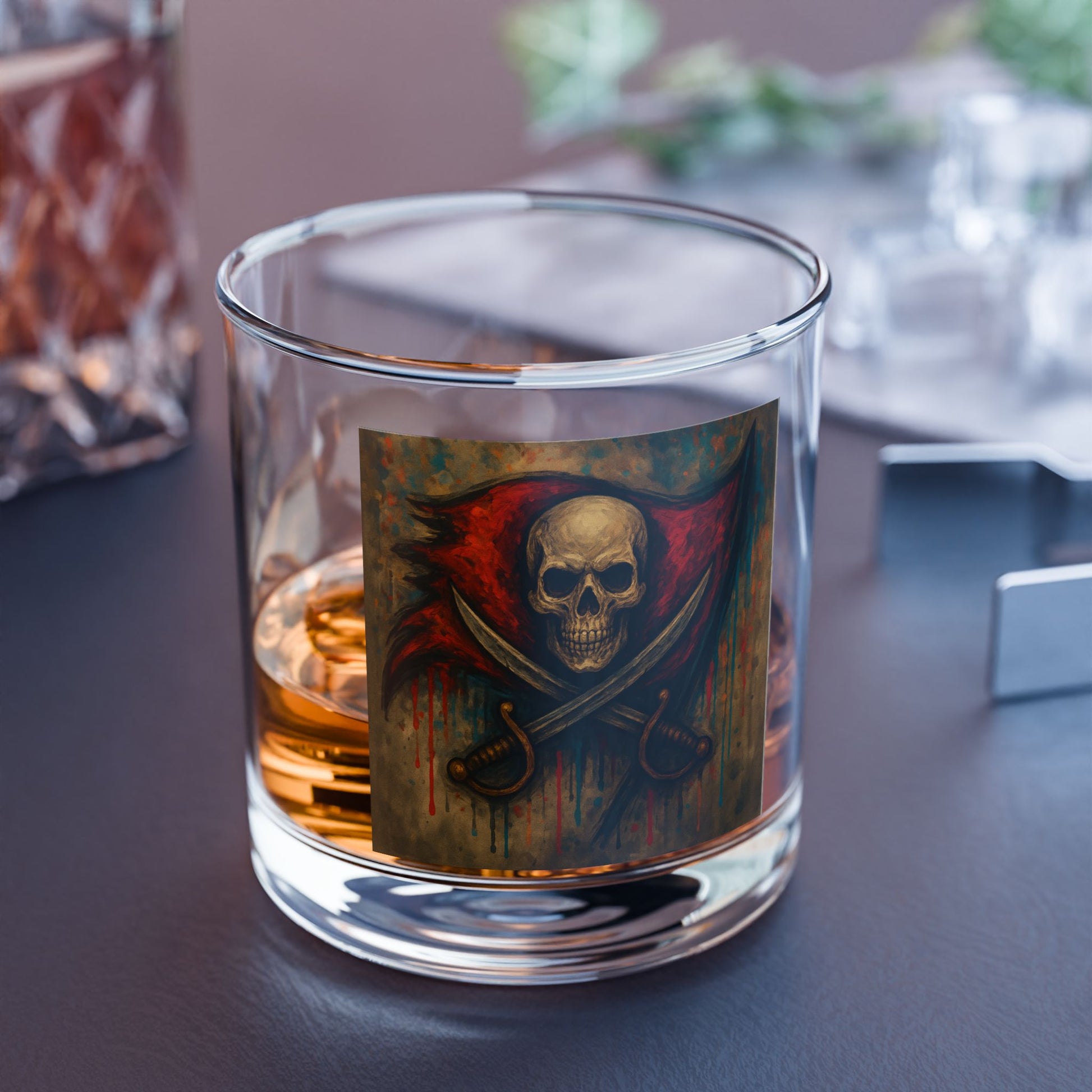 Glass with a skull and crossbones design filled with a liquid on a table.