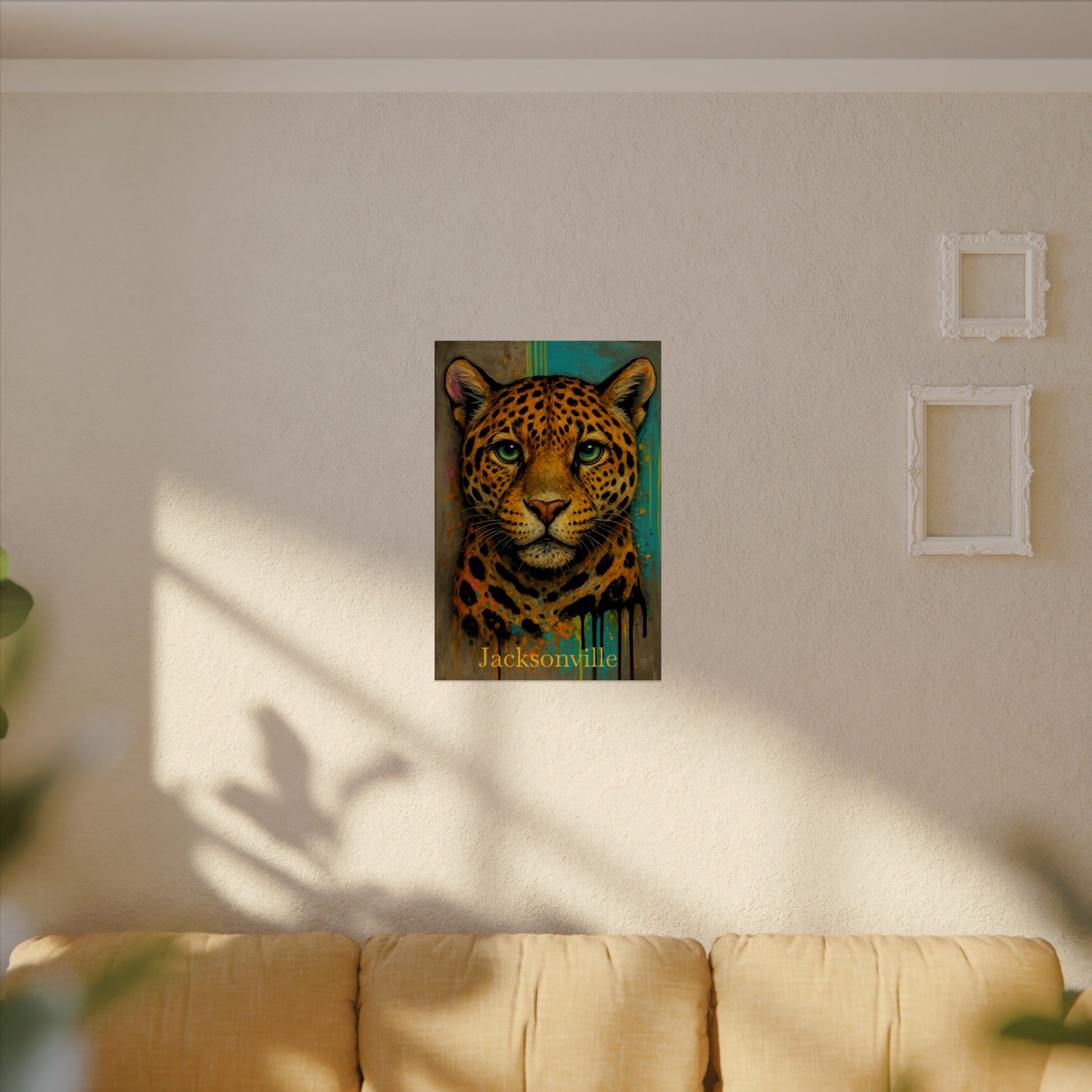 Framed artwork of a leopard on a wall above a couch