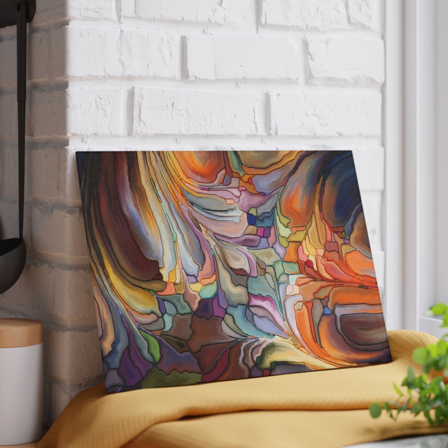 Colorful abstract painting on a white brick wall