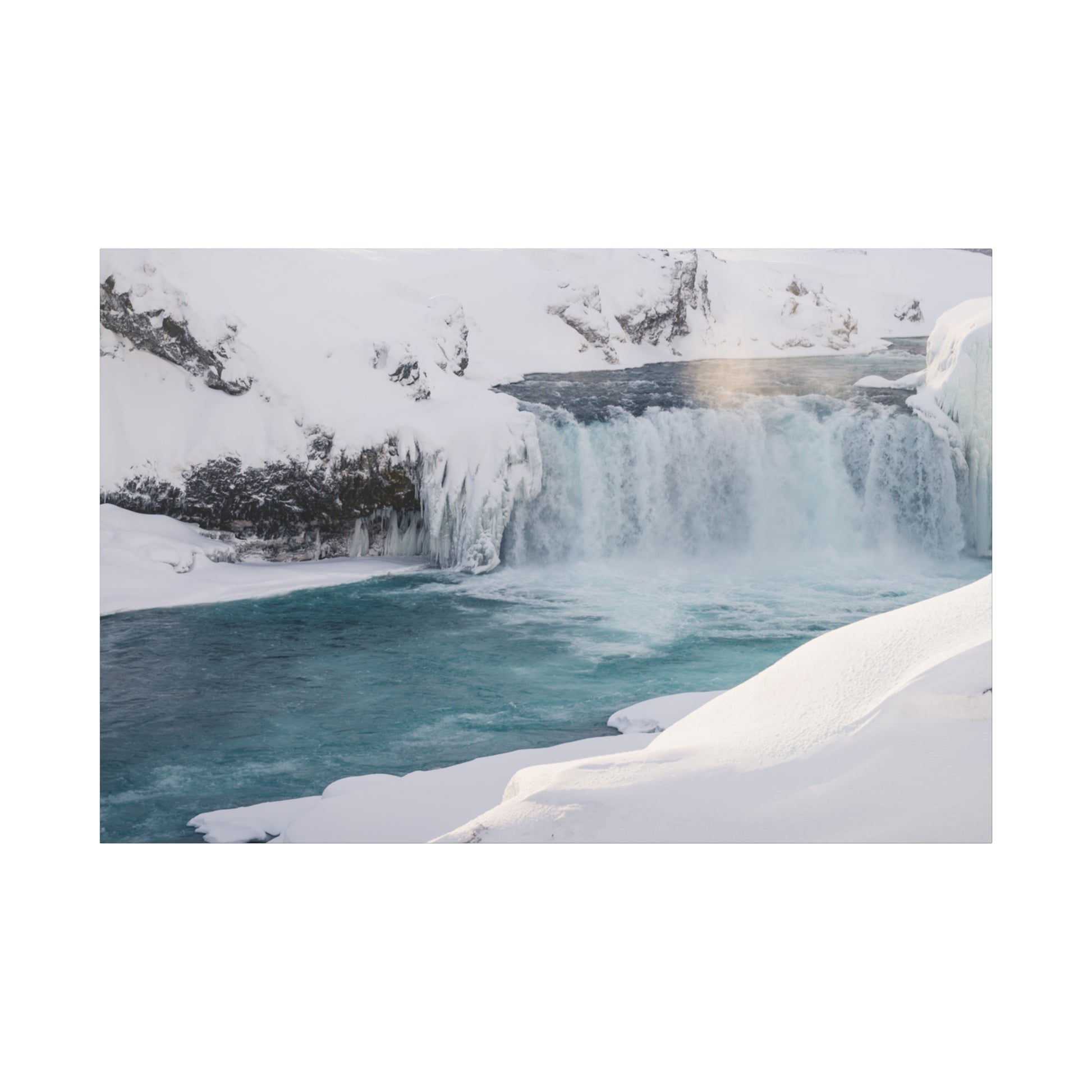 Winter landscape with a waterfall and snow-covered ground