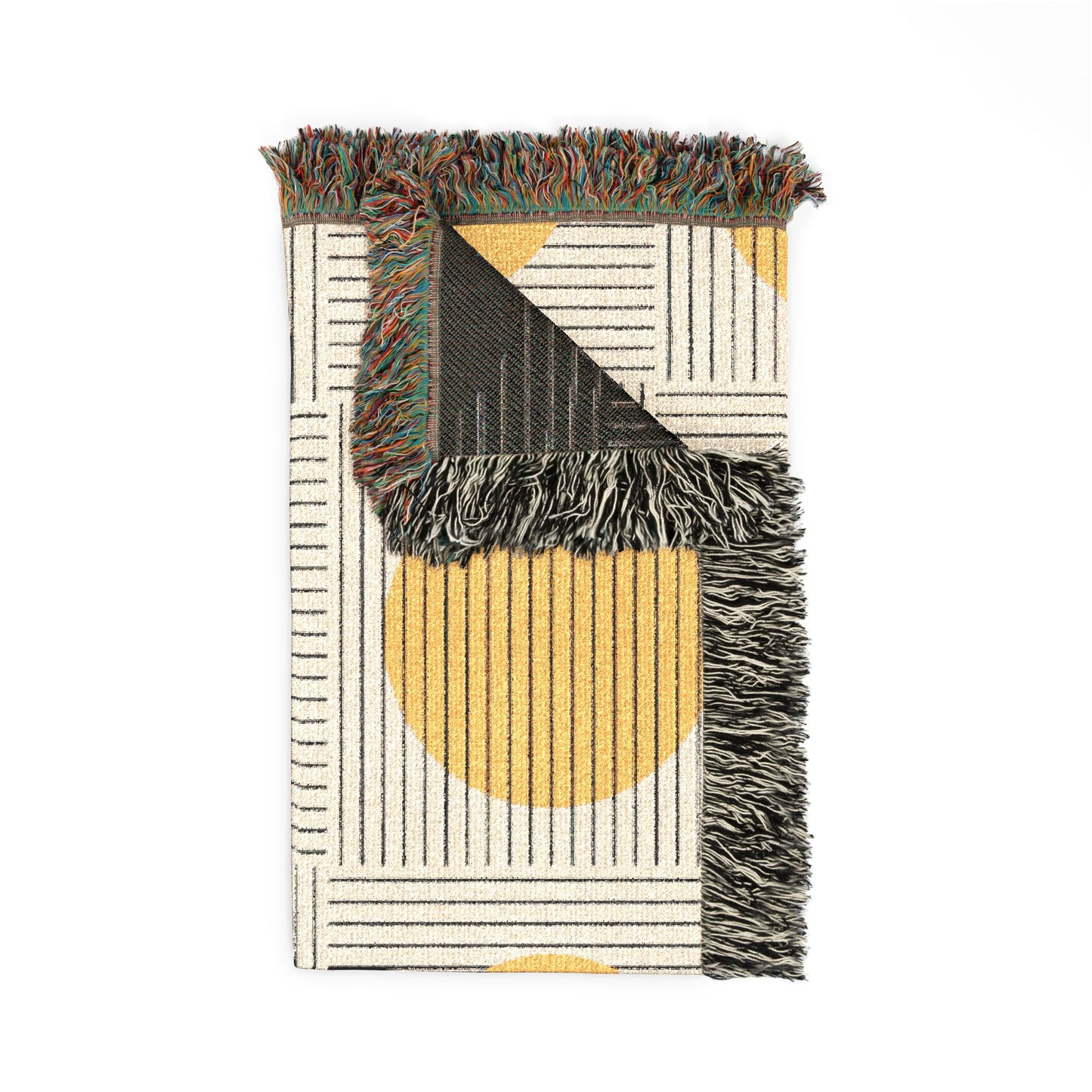 Woven rug with geometric pattern and fringed edges on a white background