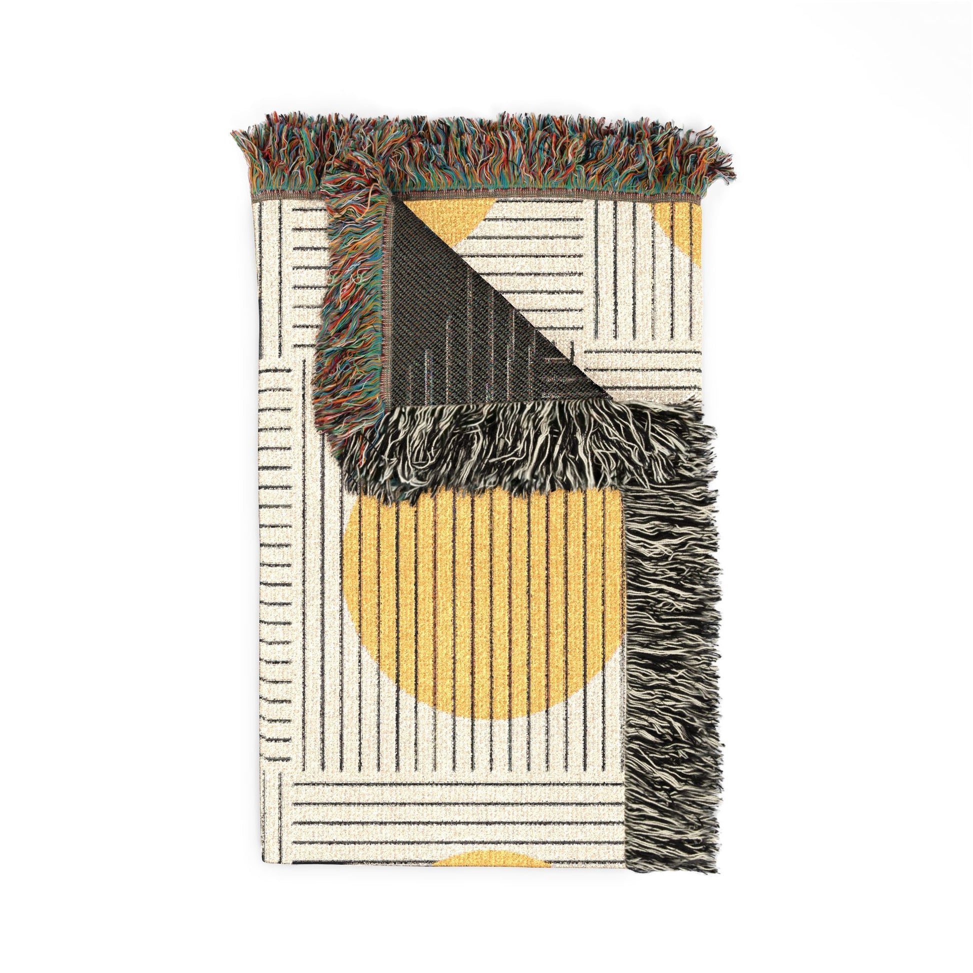Woven rug with geometric pattern and fringed edges on a white background
