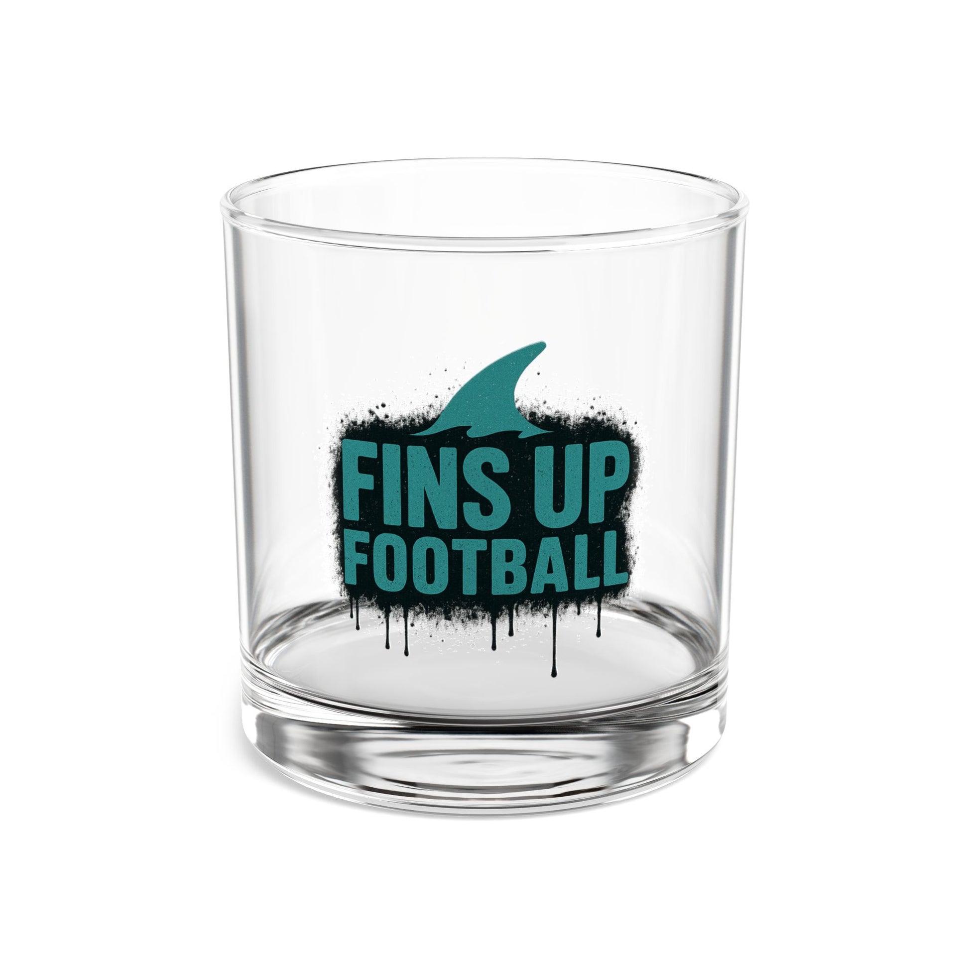 Clear glass tumbler with 'FINS UP FOOTBALL' text and shark fin design on a white background