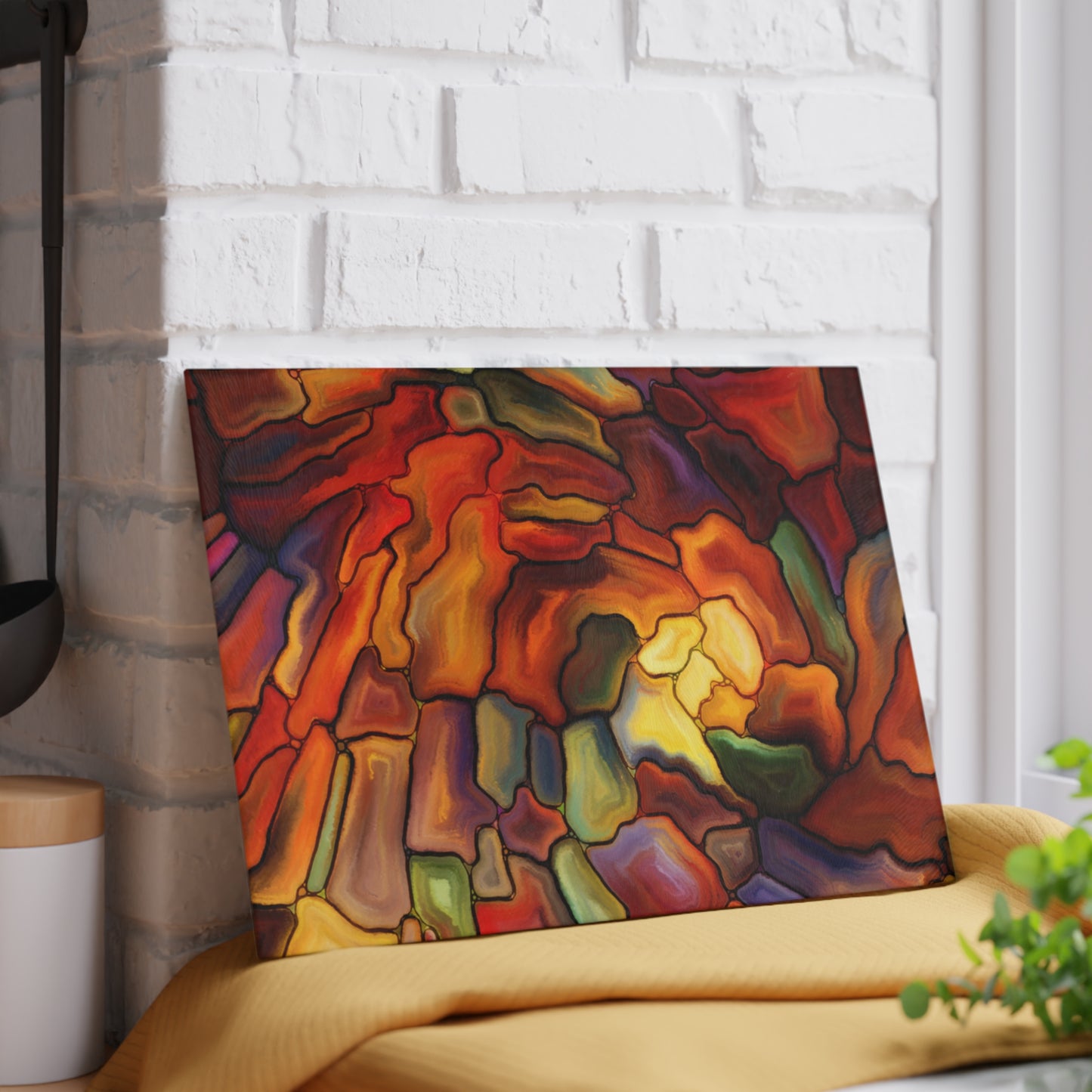 Colorful abstract painting on a white brick wall