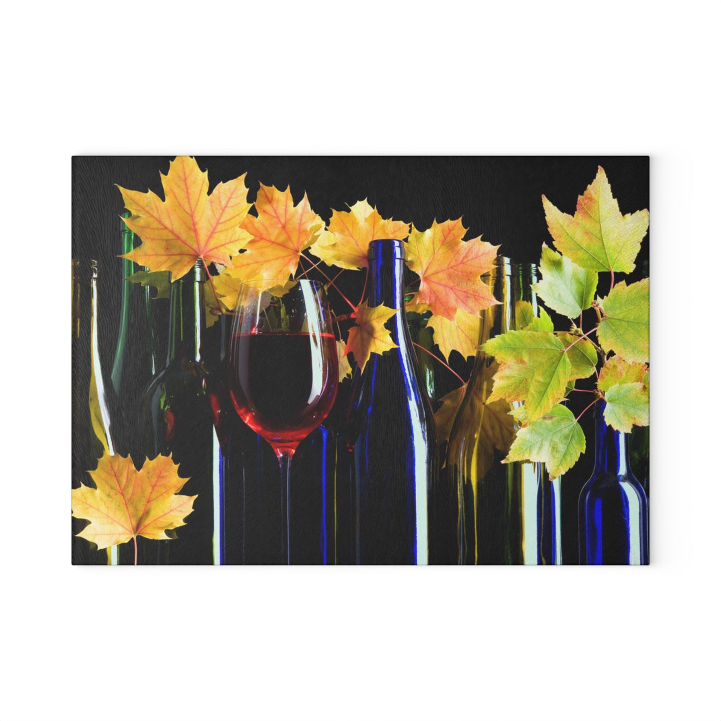 Wine bottles and glasses with autumn leaves on a black background