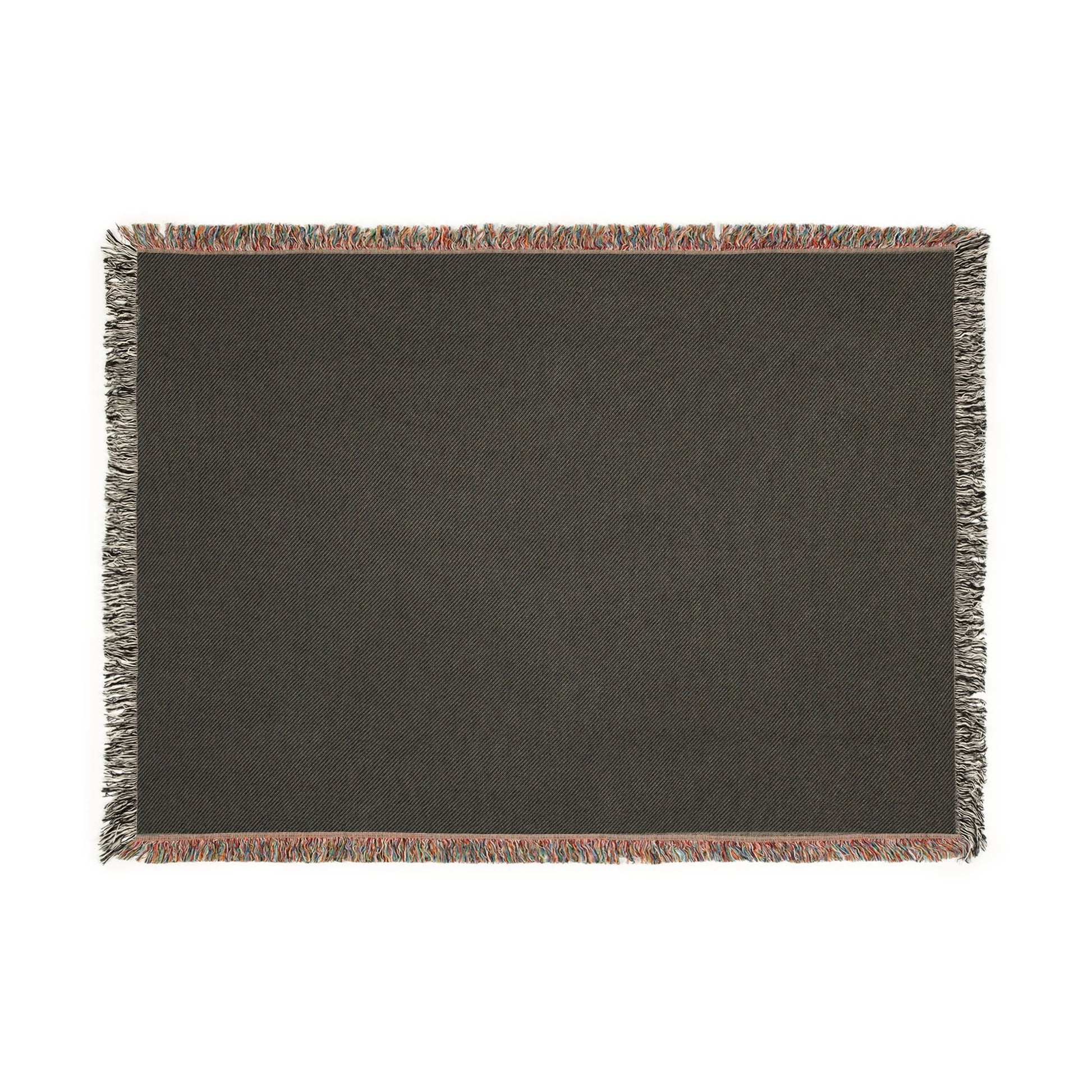 Dark gray woven blanket with fringe on a white background