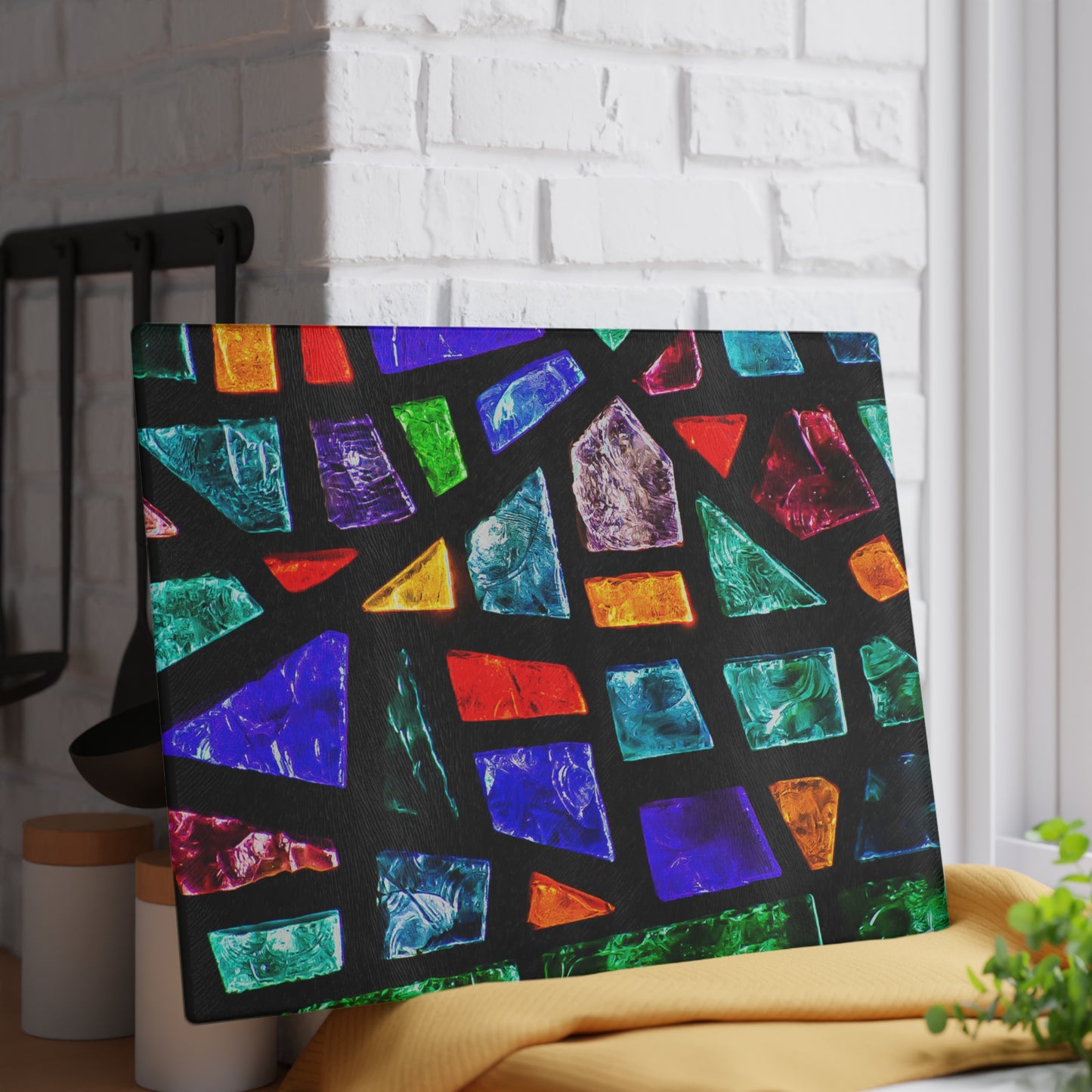 Colorful geometric patterned laptop sleeve on a white brick wall background