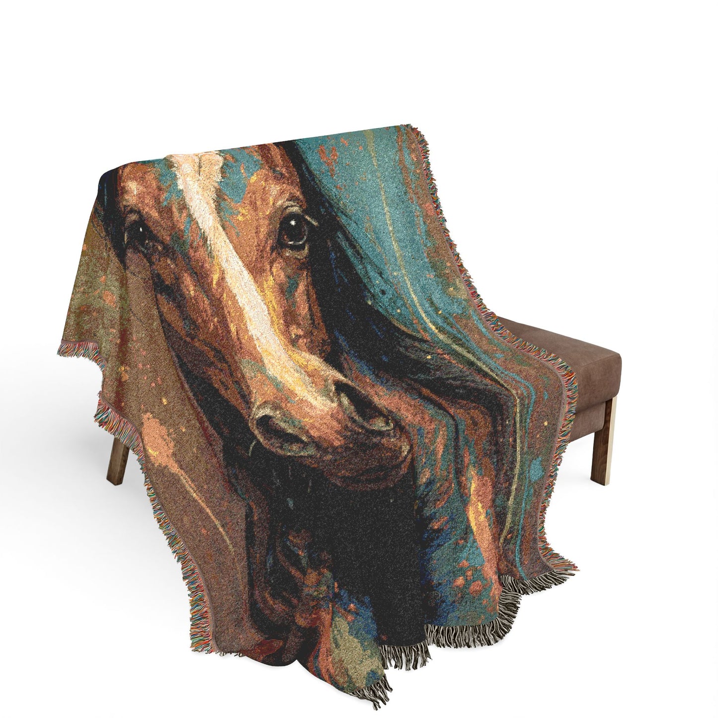 Woven blanket with horse design draped over a chair on a white background