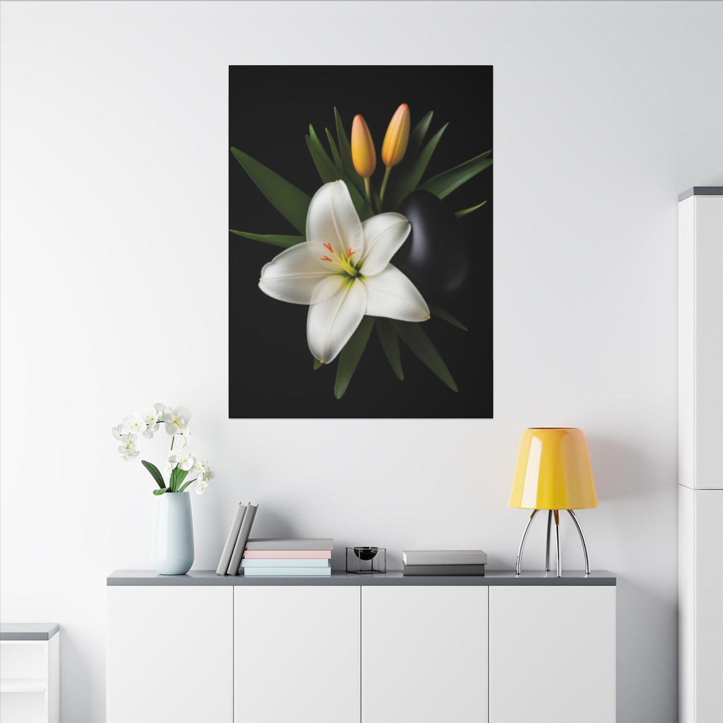 Framed floral artwork on a wall above a white cabinet with decorative items.