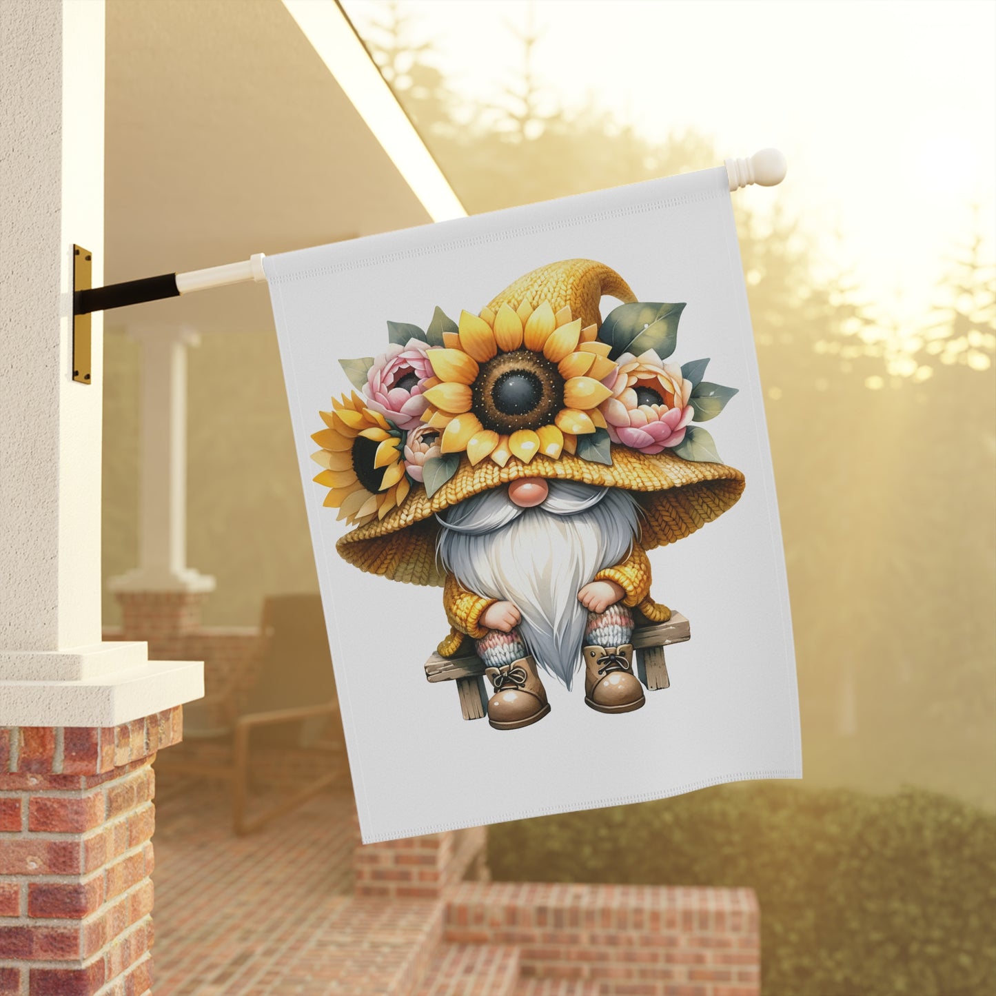 Decorative garden flag with a gnome wearing a sunflower hat hanging on a porch.