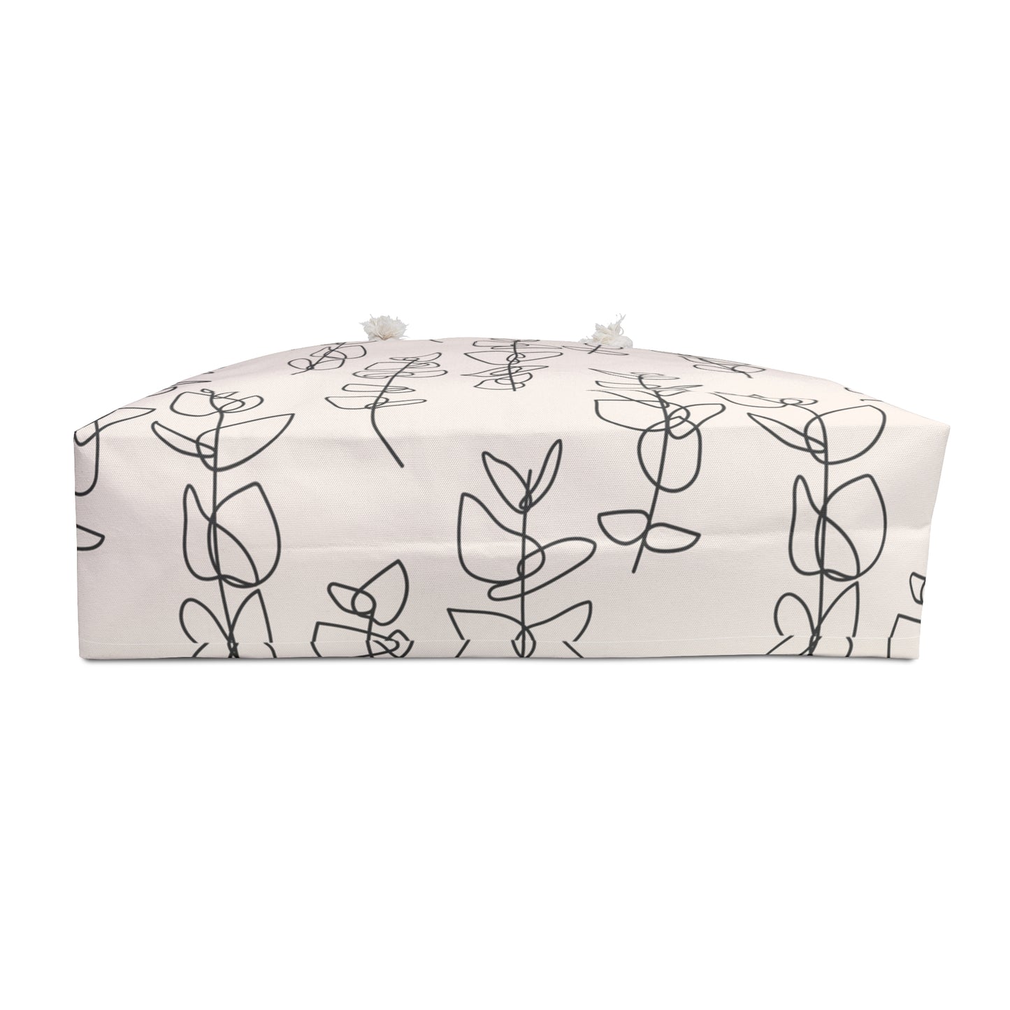 Rectangular cushion with black line art design on a white background