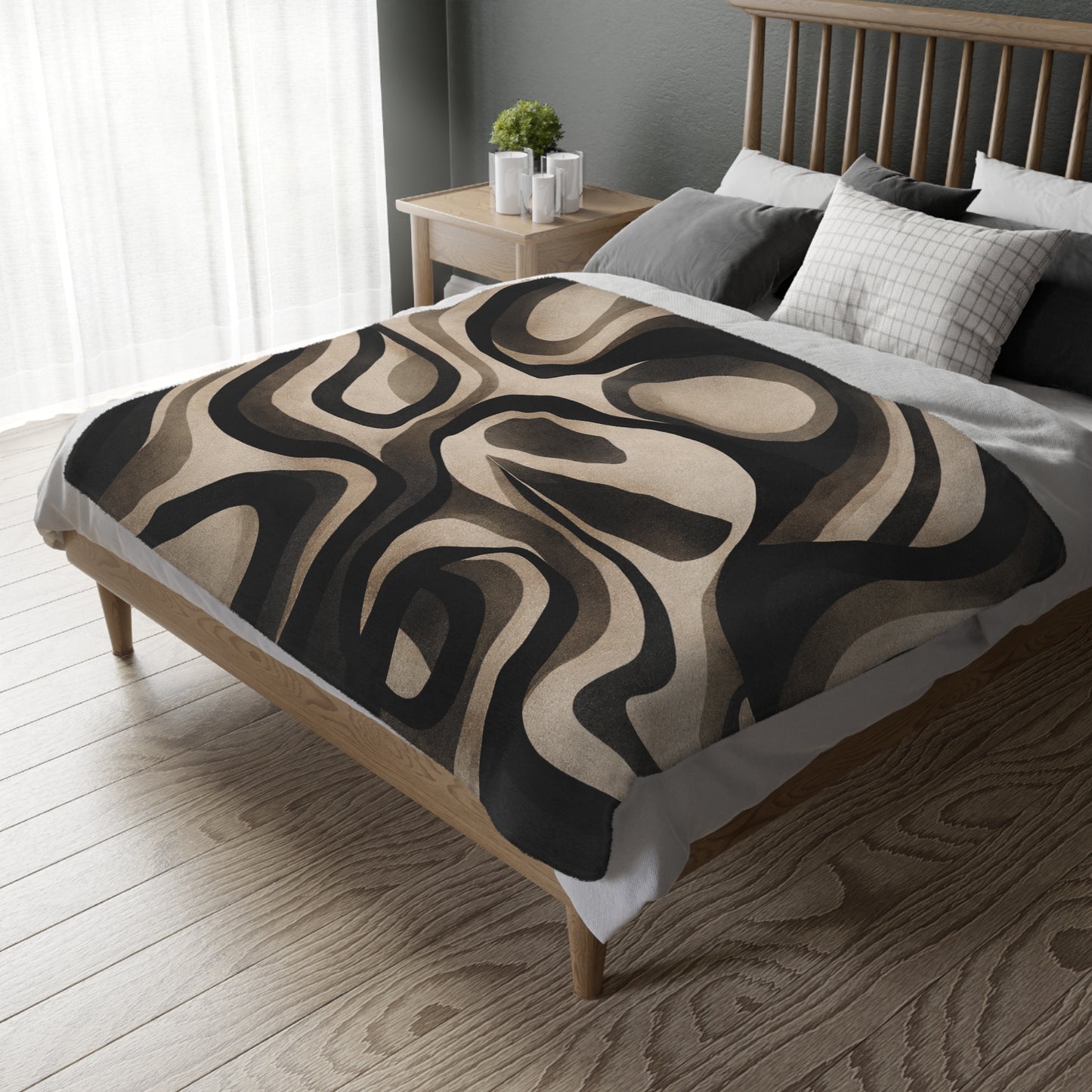 Bed with a patterned comforter in a bedroom setting