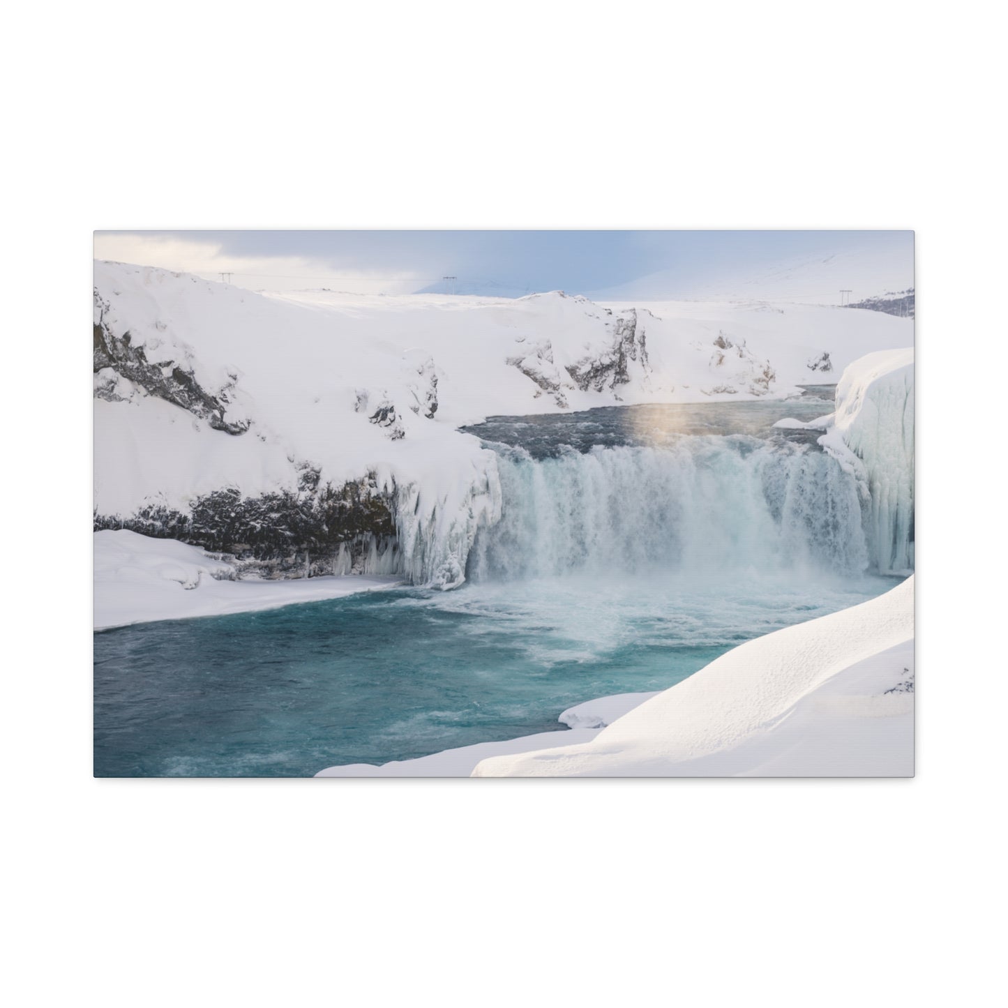 Frozen waterfall in a snowy landscape
