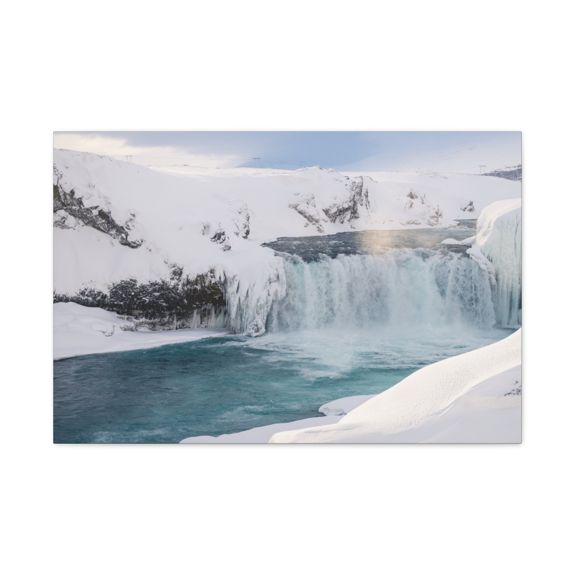 Frozen waterfall in a snowy landscape