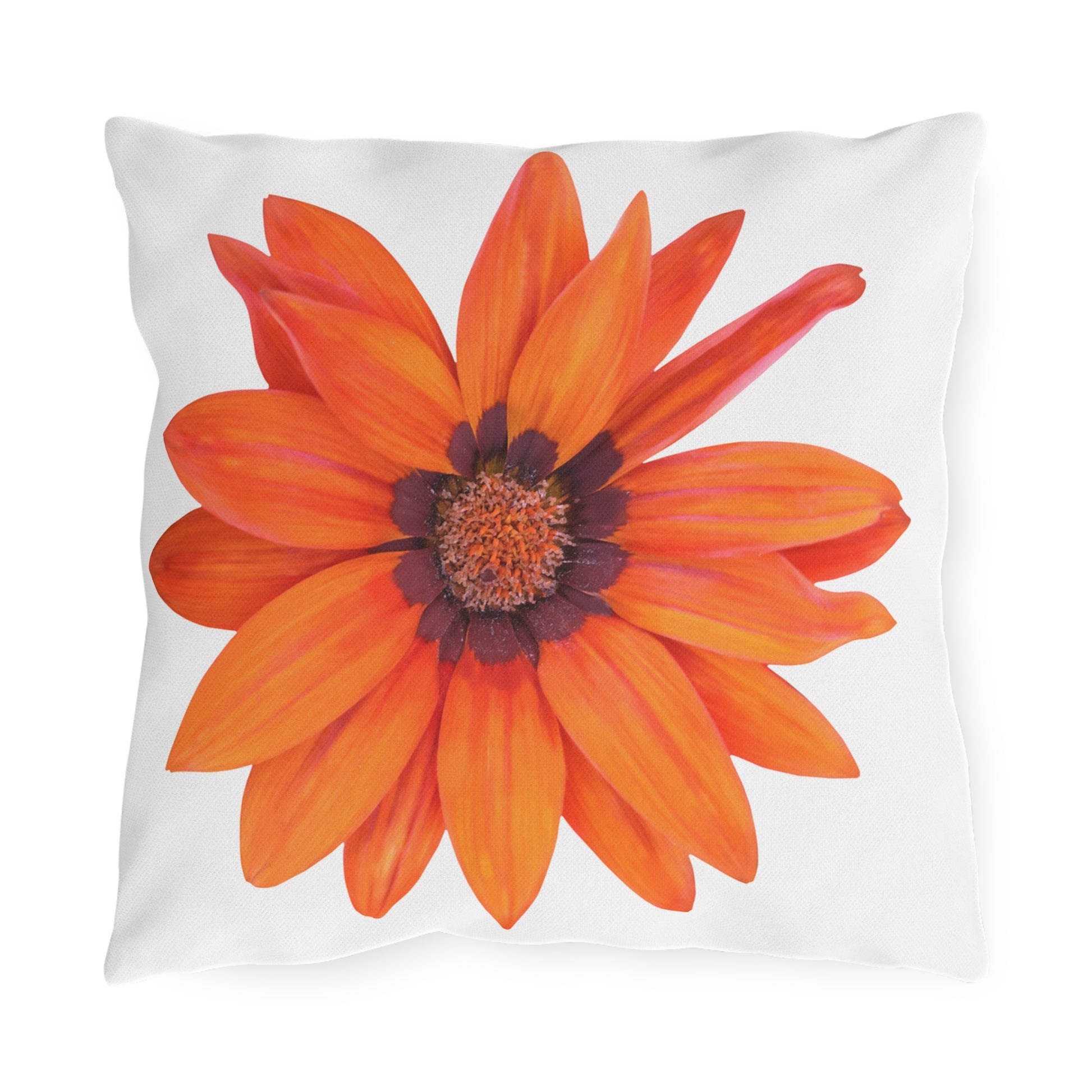 Pillow with a large orange flower design on a white background