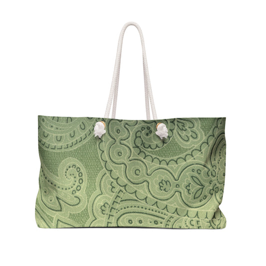 Green patterned bag with white handles on a white background