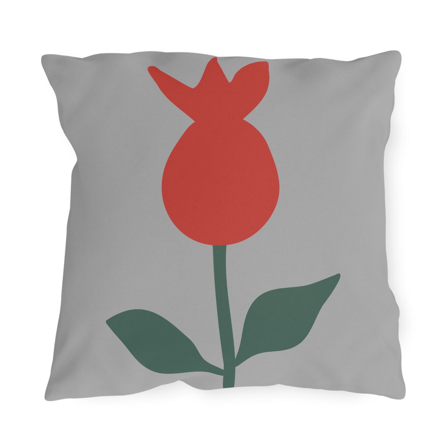 Gray pillow with a red tulip design on a white background