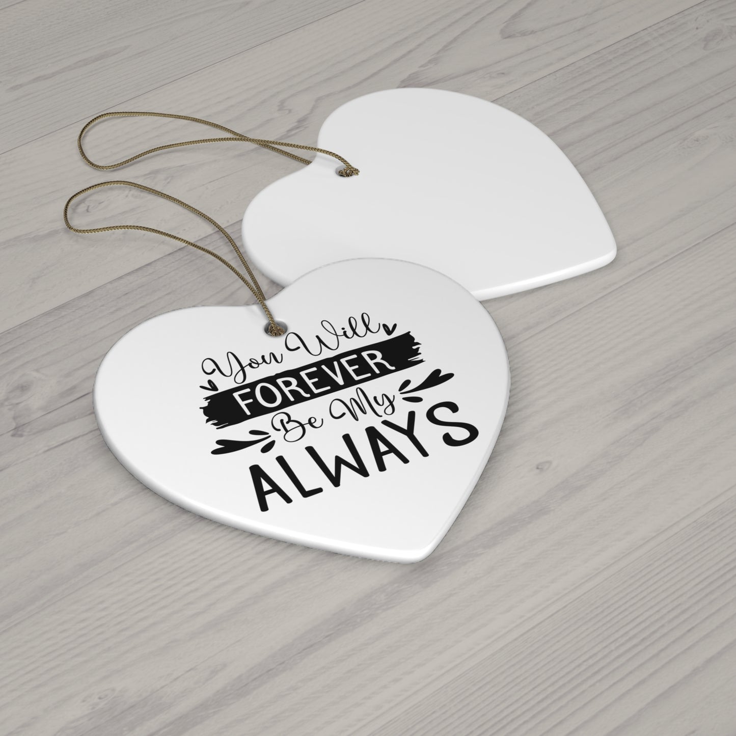 Heart-shaped ceramic plaque with 'You Will Forever Be My Always' text on a wooden surface