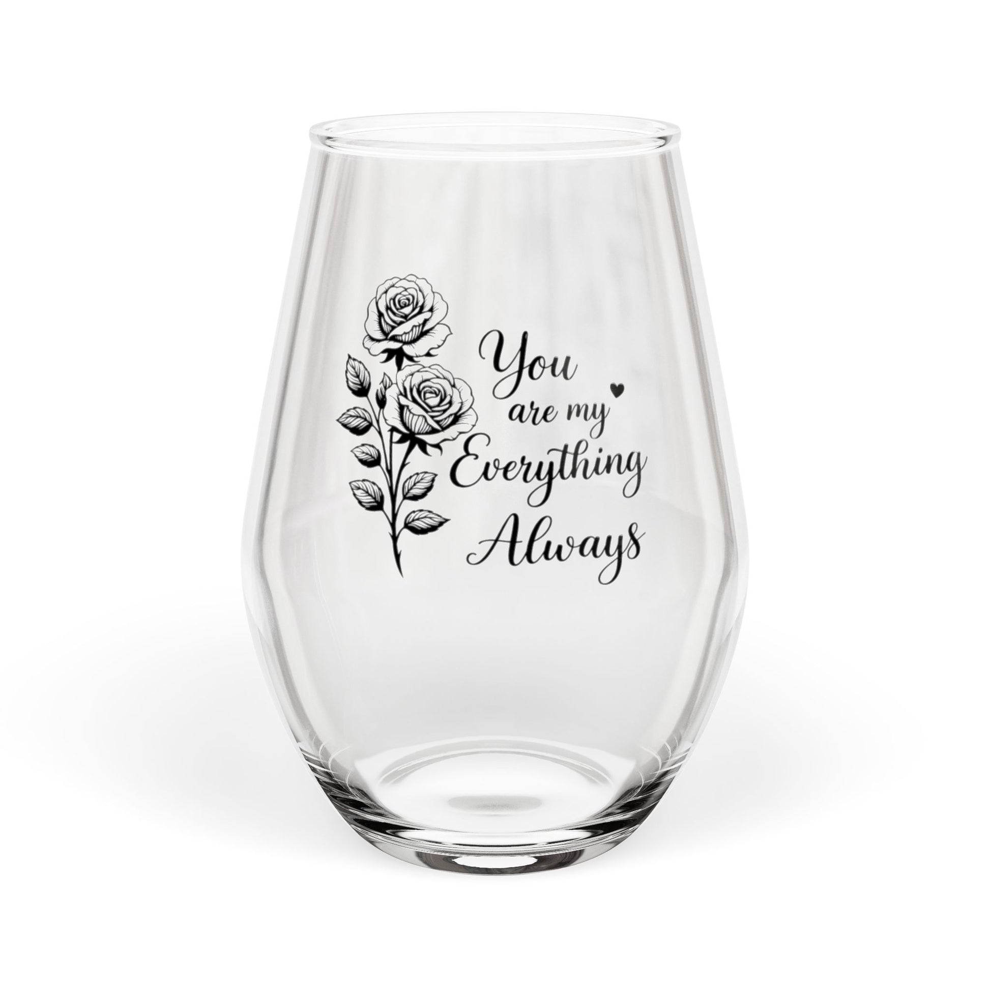 Clear glass wine glass with floral design and text on a white background