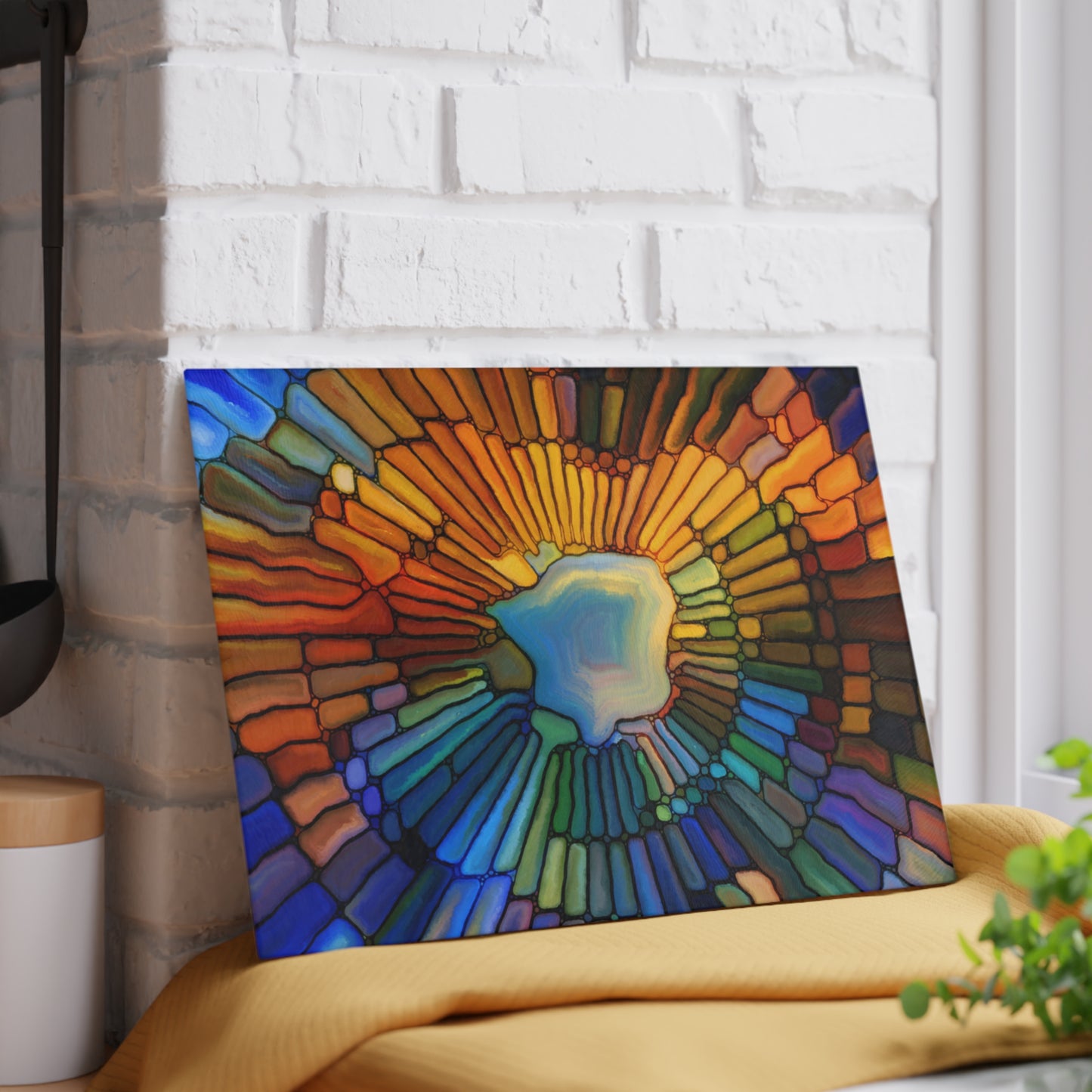 Colorful abstract art piece on a white brick wall