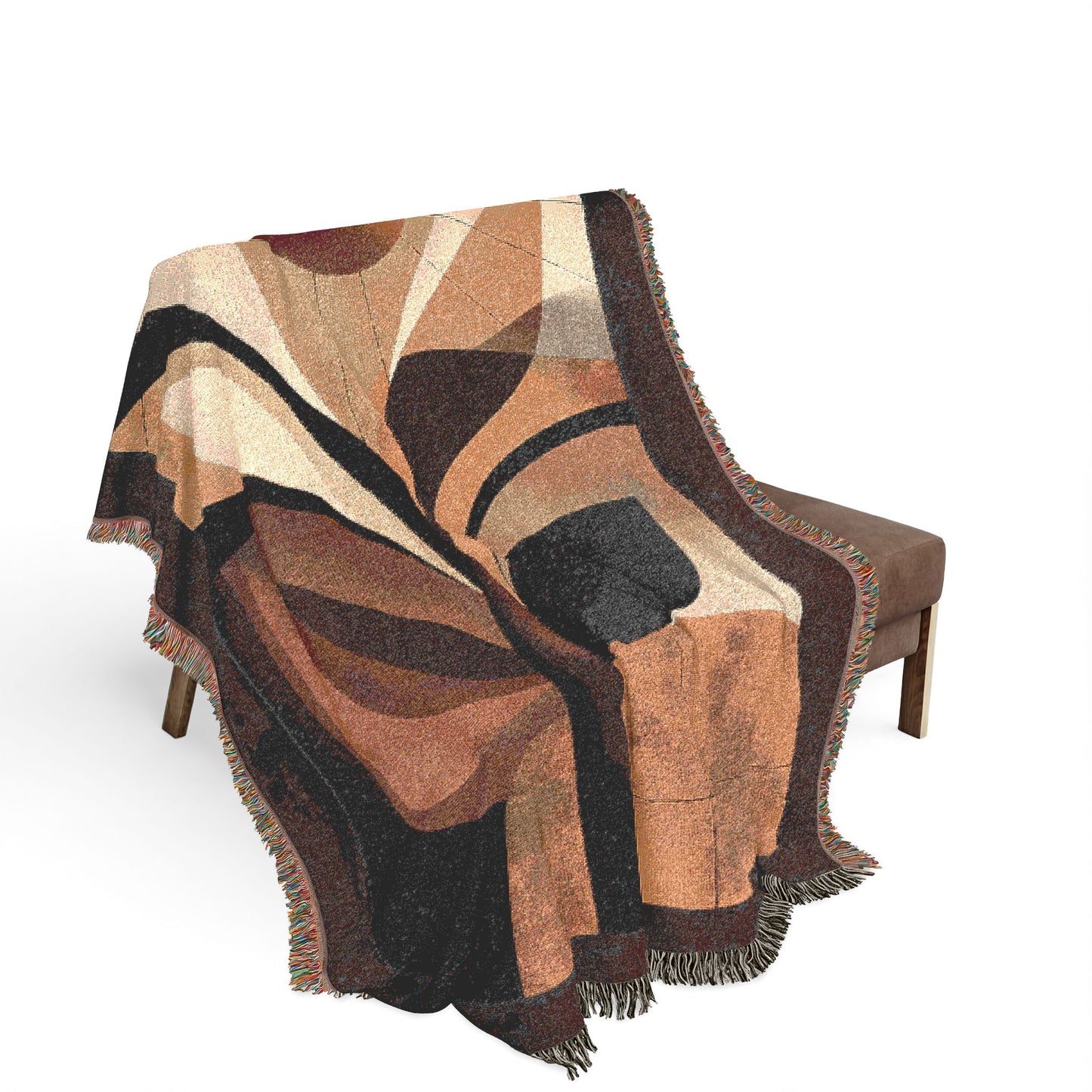 Patterned blanket draped over a chair on a white background