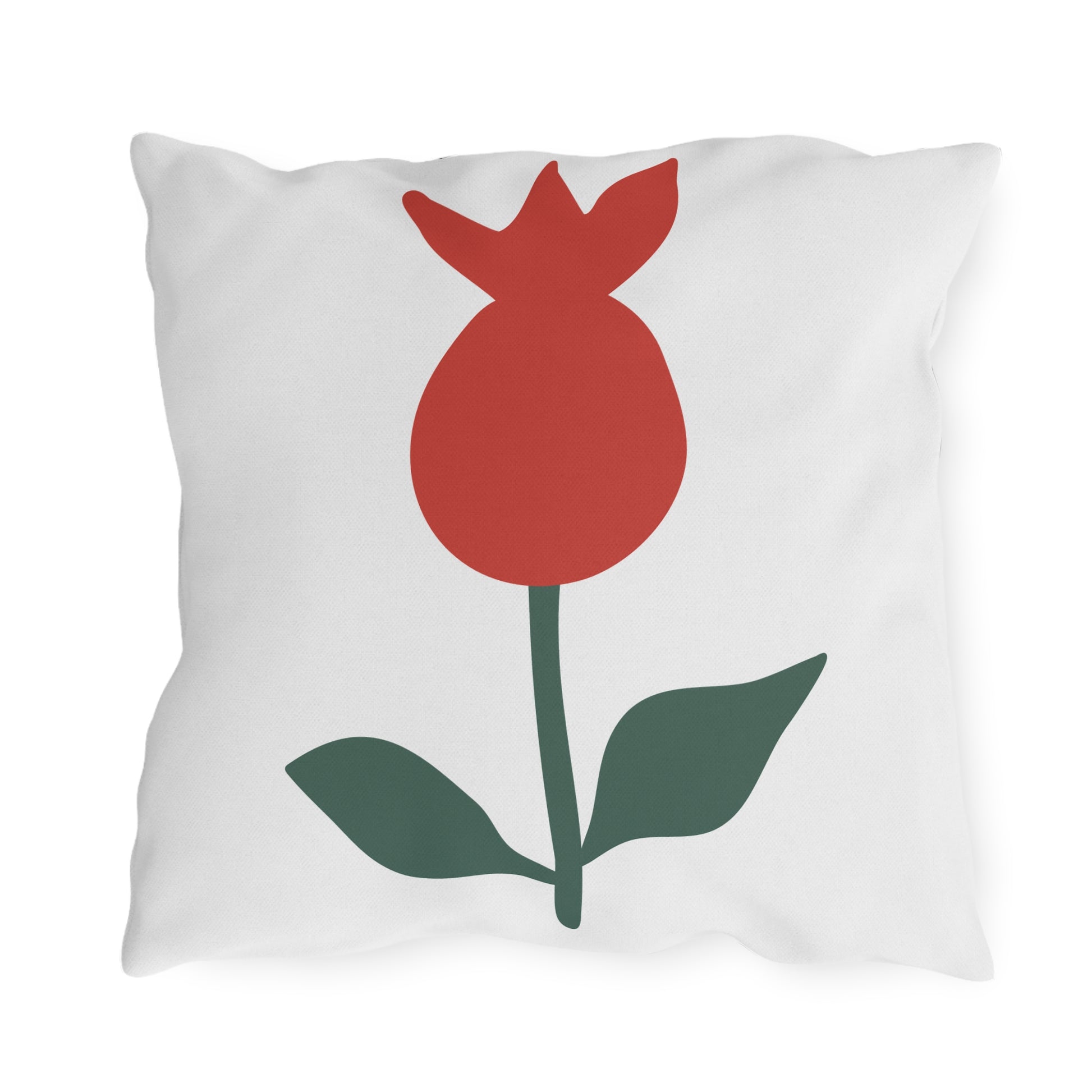 Pillow with a red flower and green leaves design on a white background