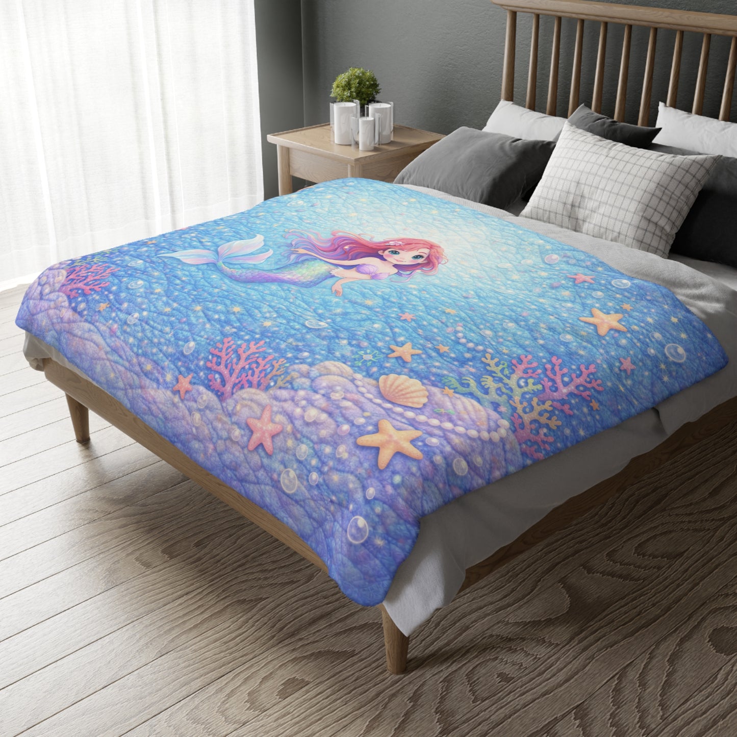 Bed with a colorful mermaid-themed comforter in a bedroom setting.